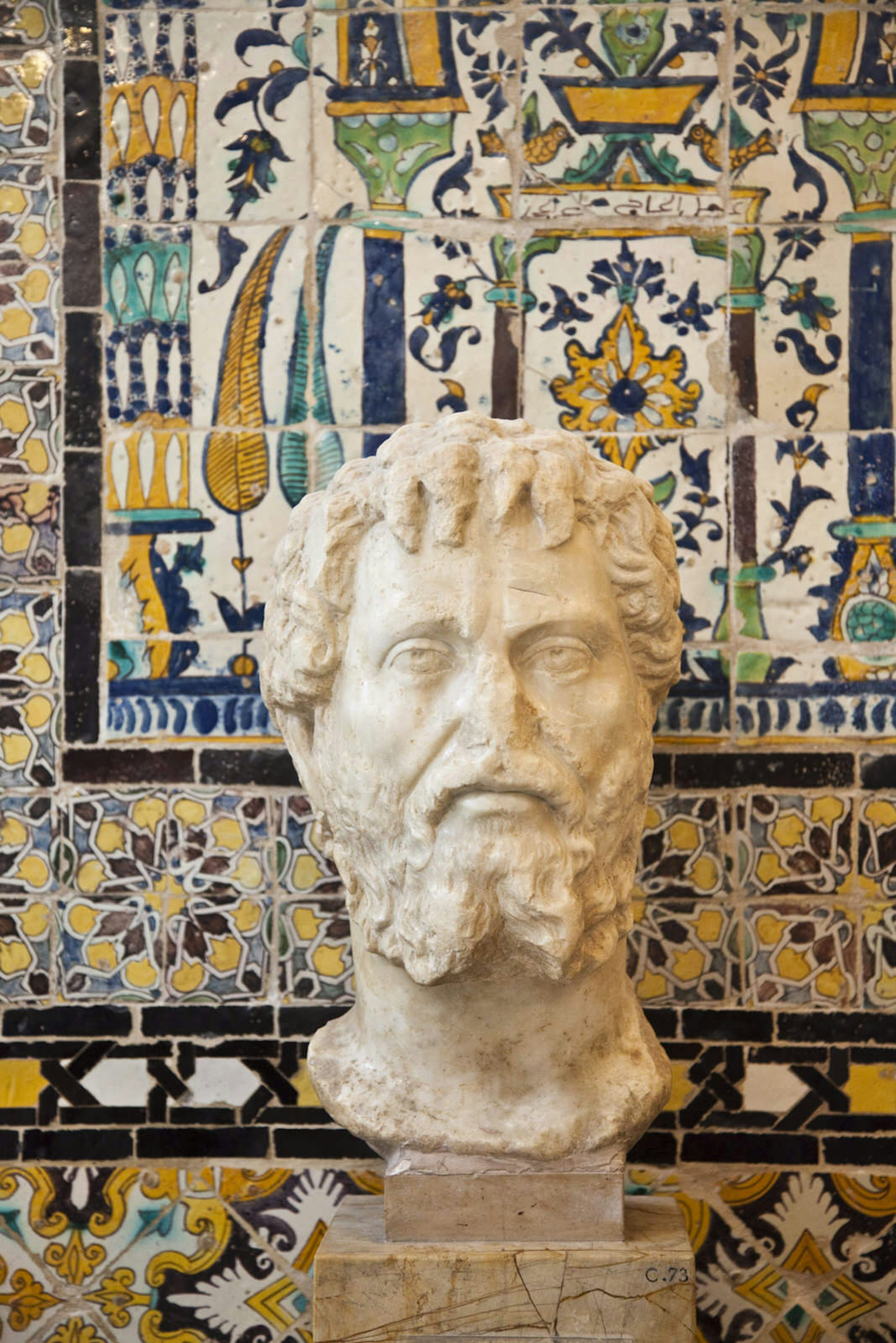 Roman-era relics stand in front of old Ottoman palace walls at Tunis' Bardo Museum © Walter Bibikow / Getty Images