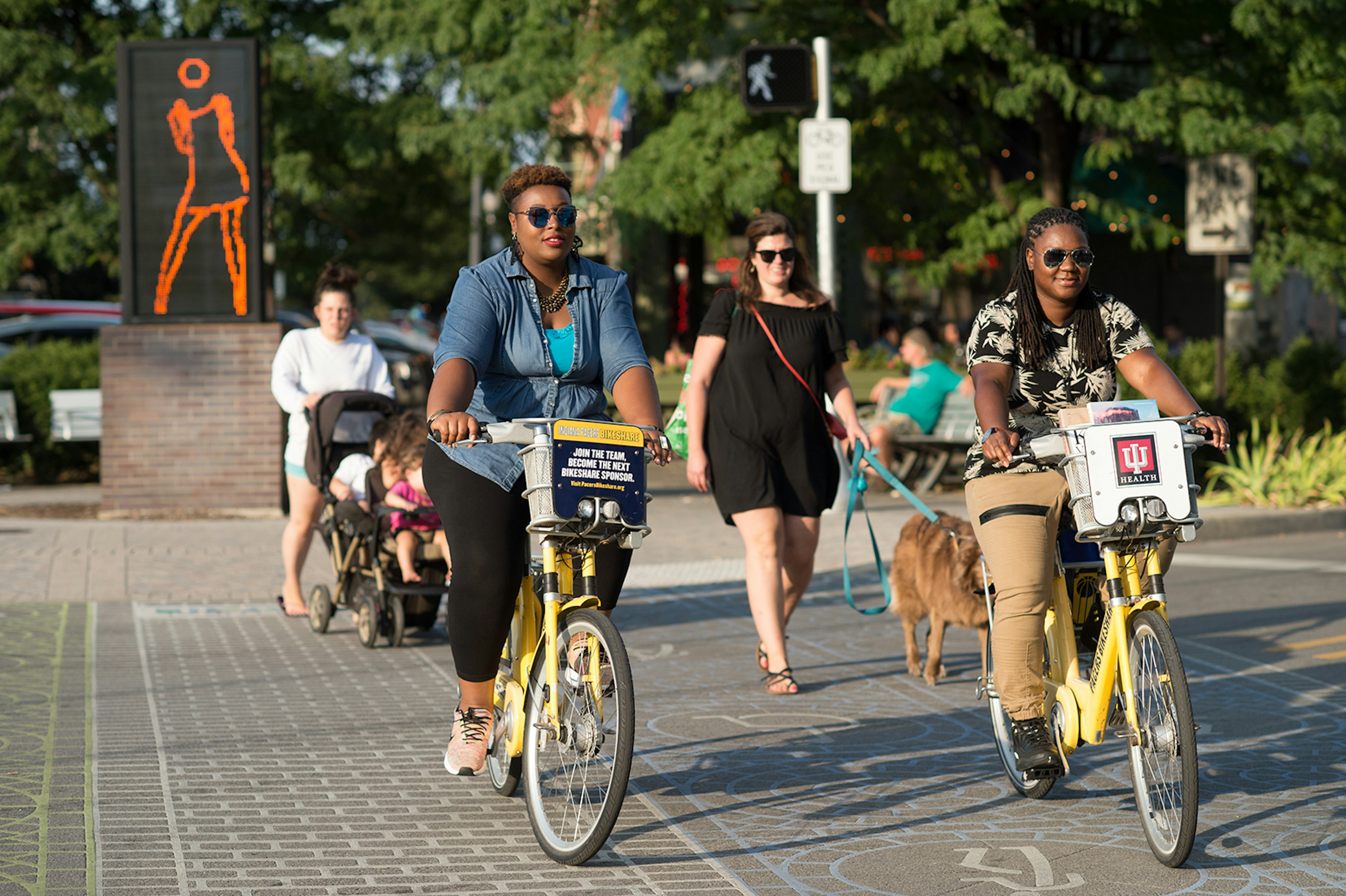 women cyclists on a sunny day in Indianapolis