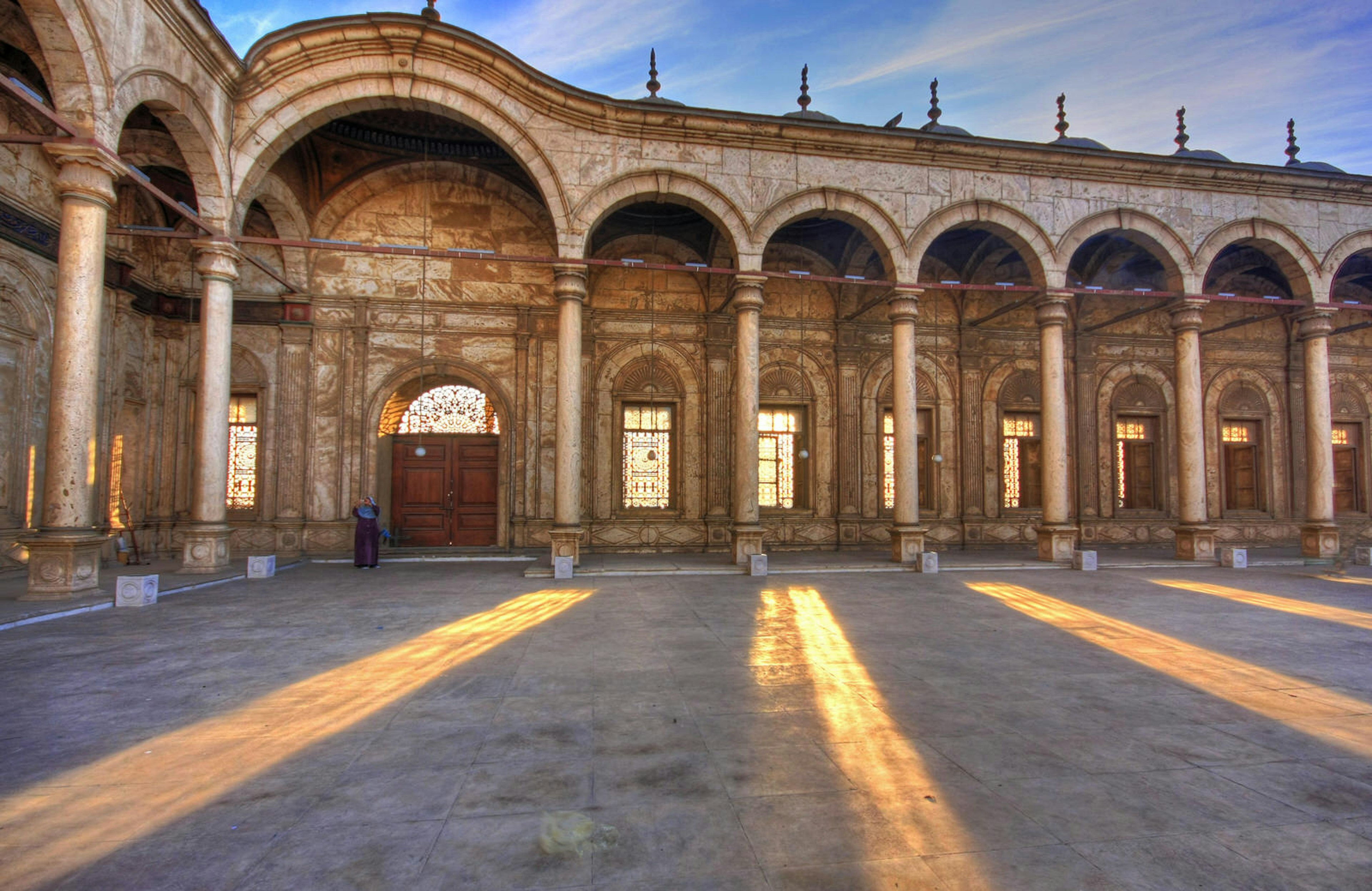 The setting sun streams through the windows of the Muhammad Ali Mosque in the Citadel in Cairo, Egypt