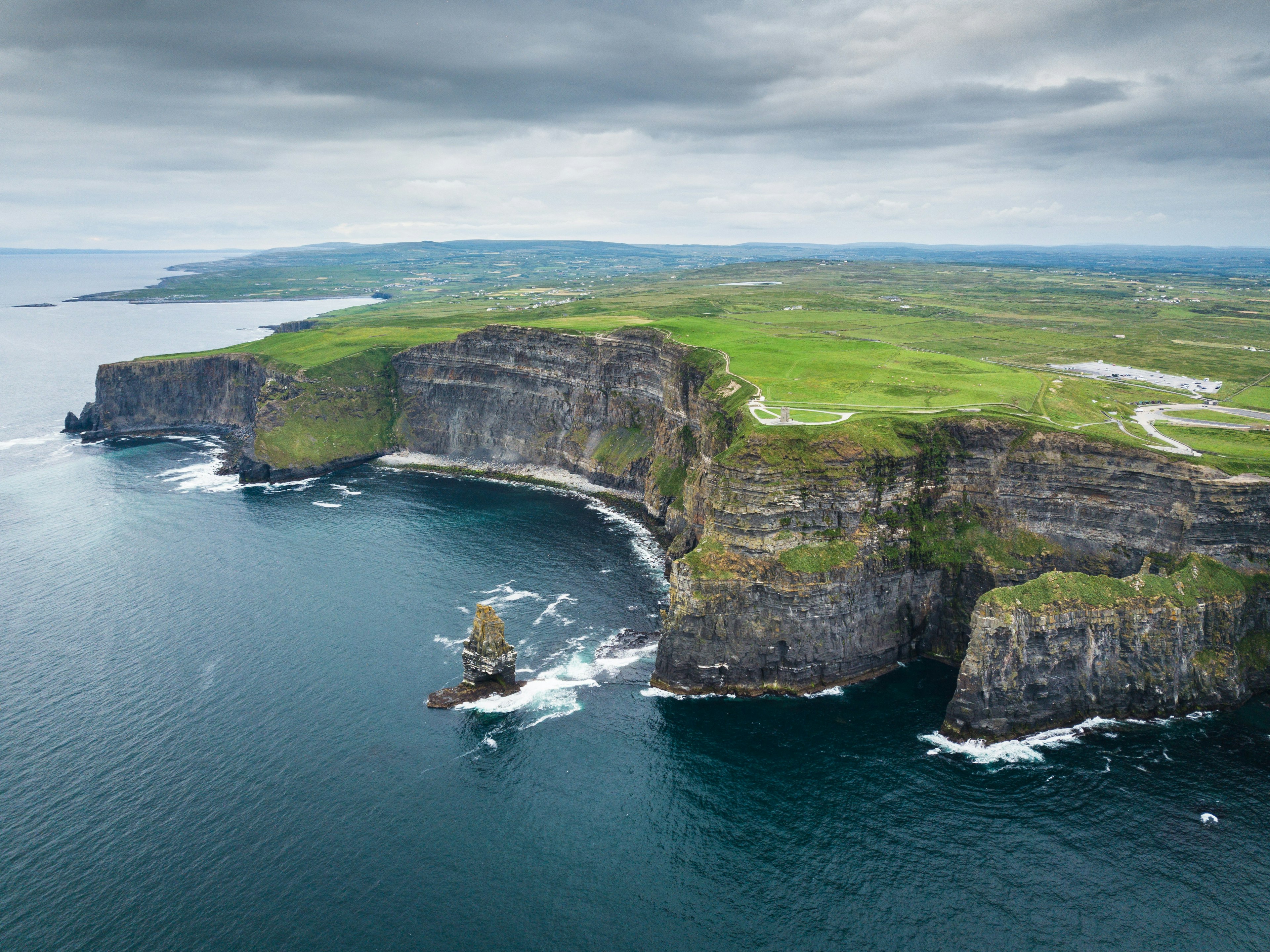 An aerial view of rocky, green cliffs