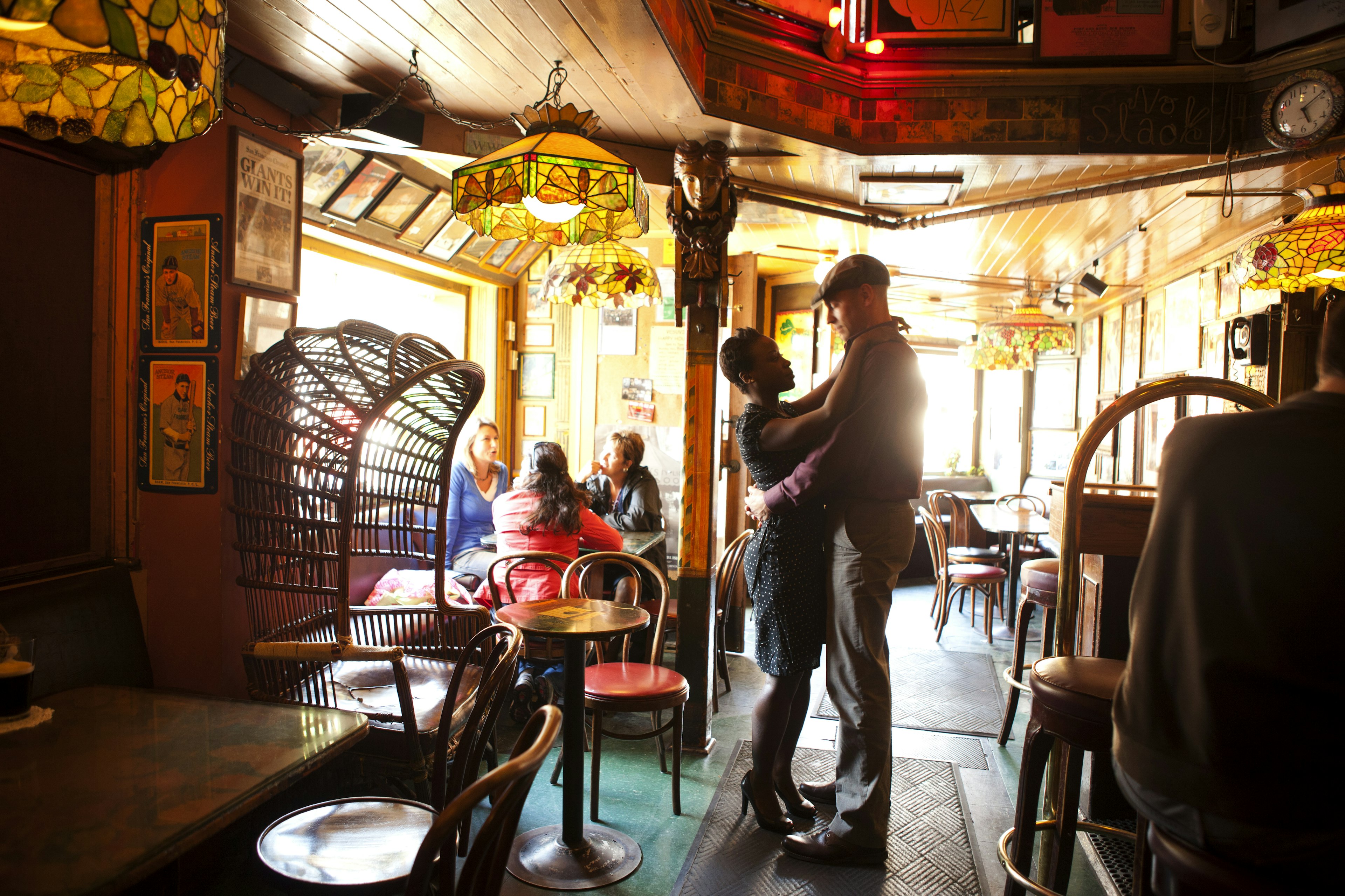 A couple dances in a bar