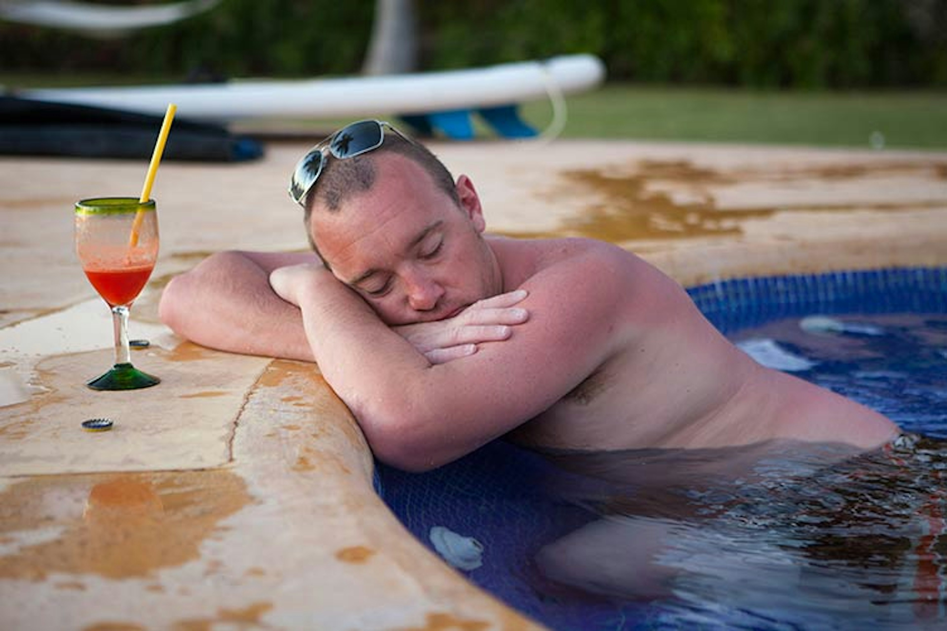 This gentleman will probably regret not swimming the extra yards to the covered, swim-up bar. Image by Heath Korvola / The Image Bank / Getty Images.