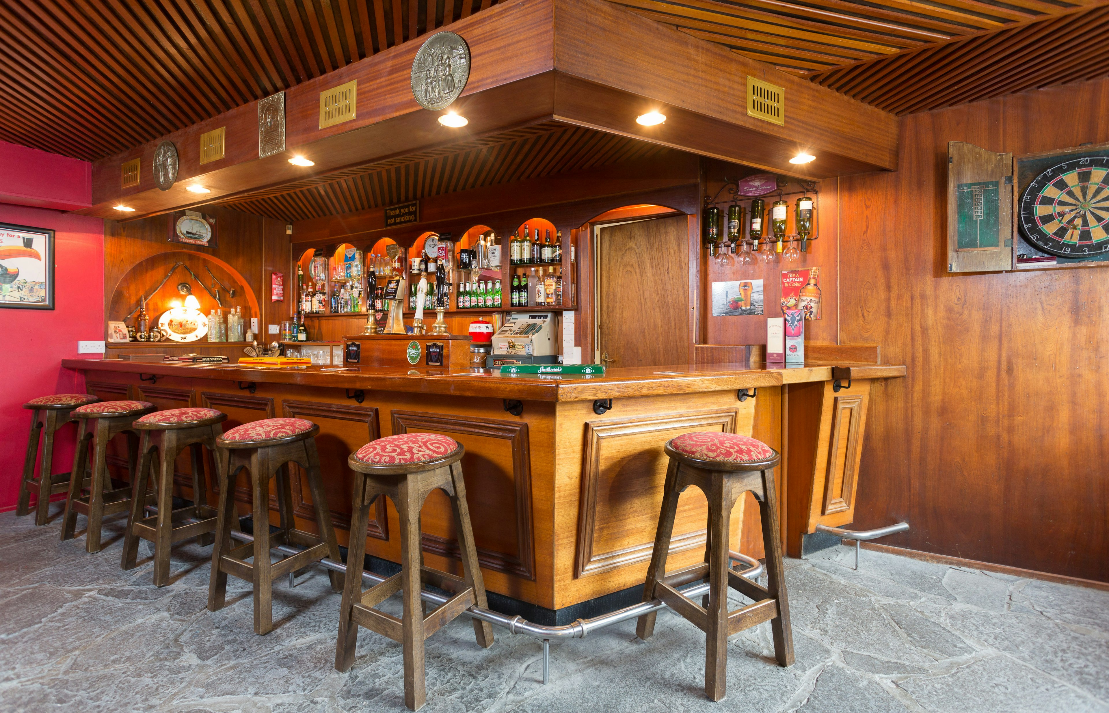 Stools in front of a classic bar.