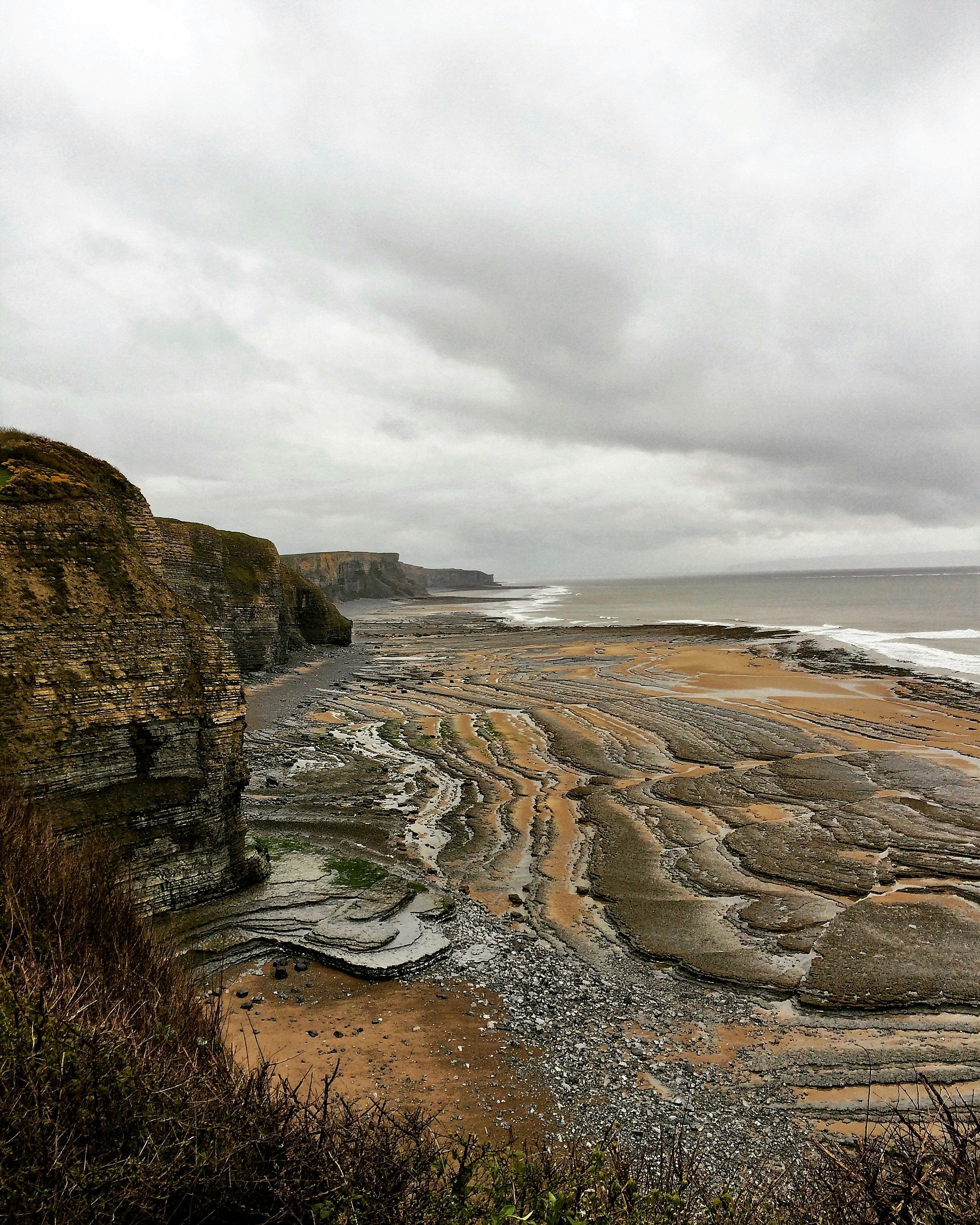 Grey clouds over Monknash beach which is famous for fossils