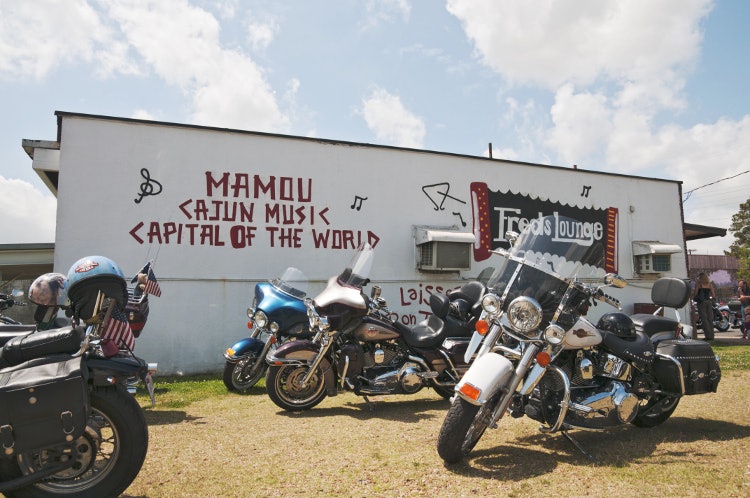 Motorbikes outside Fred's Lounge. Image by Stephen Saks / Lonely Planet Images / Getty Images