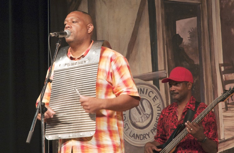 Metal frottoir being played with spoons in a zydeco band. Image by Stephen Saks / Lonely Planet Images / Getty Images