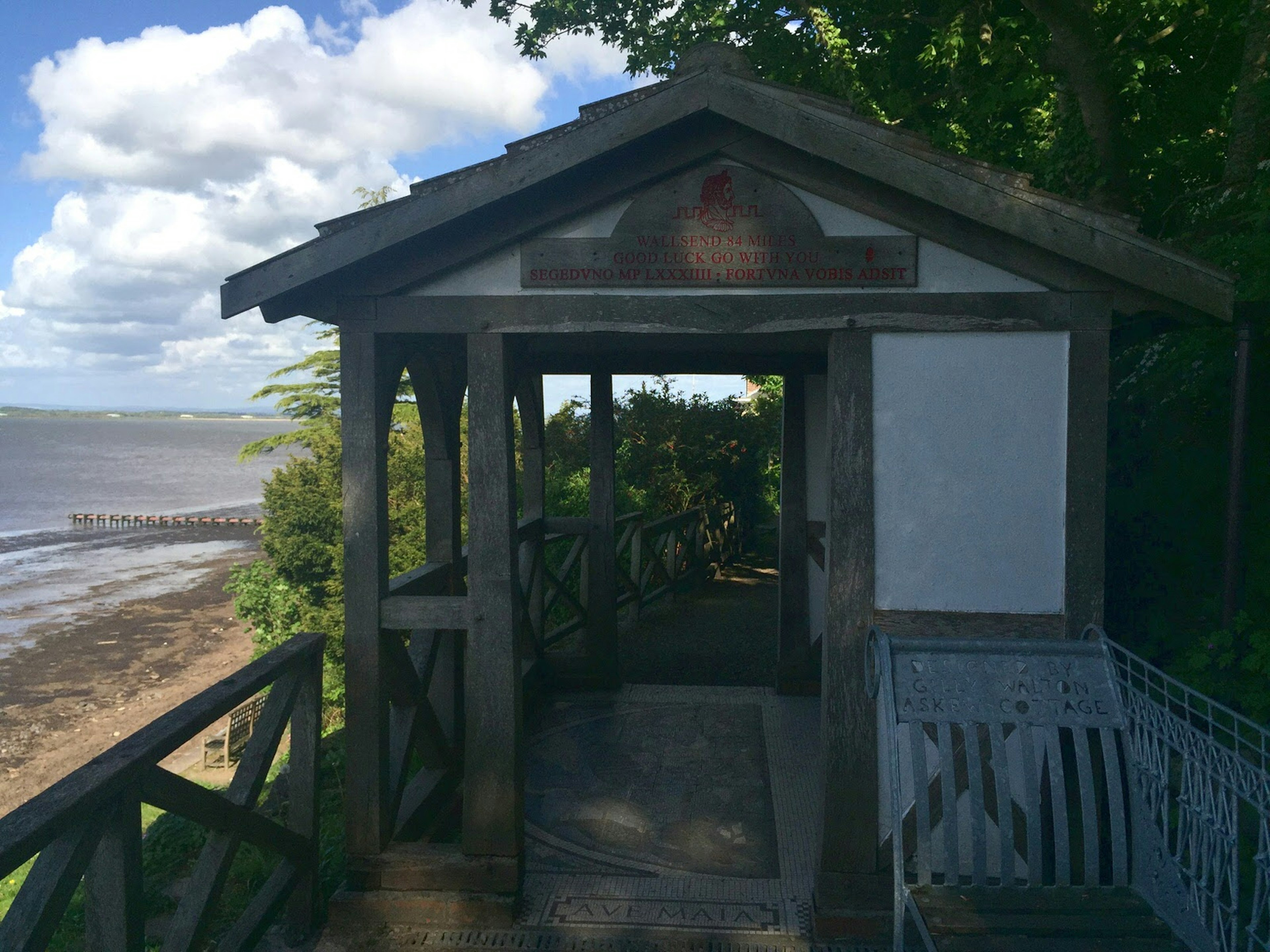 A small cabin located next to a river