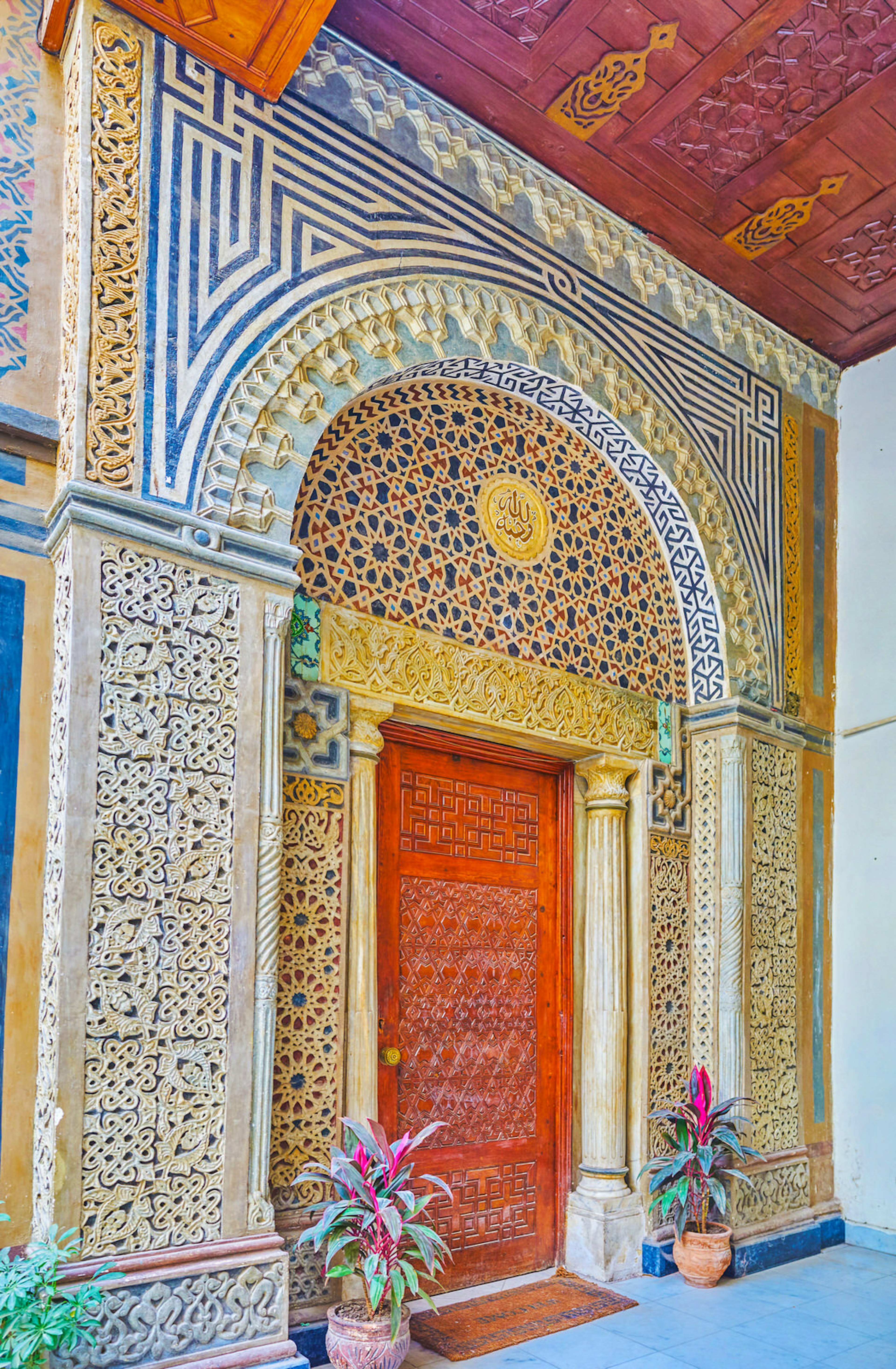 The beautiful stone entrance portal of the St Virgin Mary Church in Coptic neighbourhood, decorated with Islamic-style patterns and geometric mosaics, Cairo, Egypt