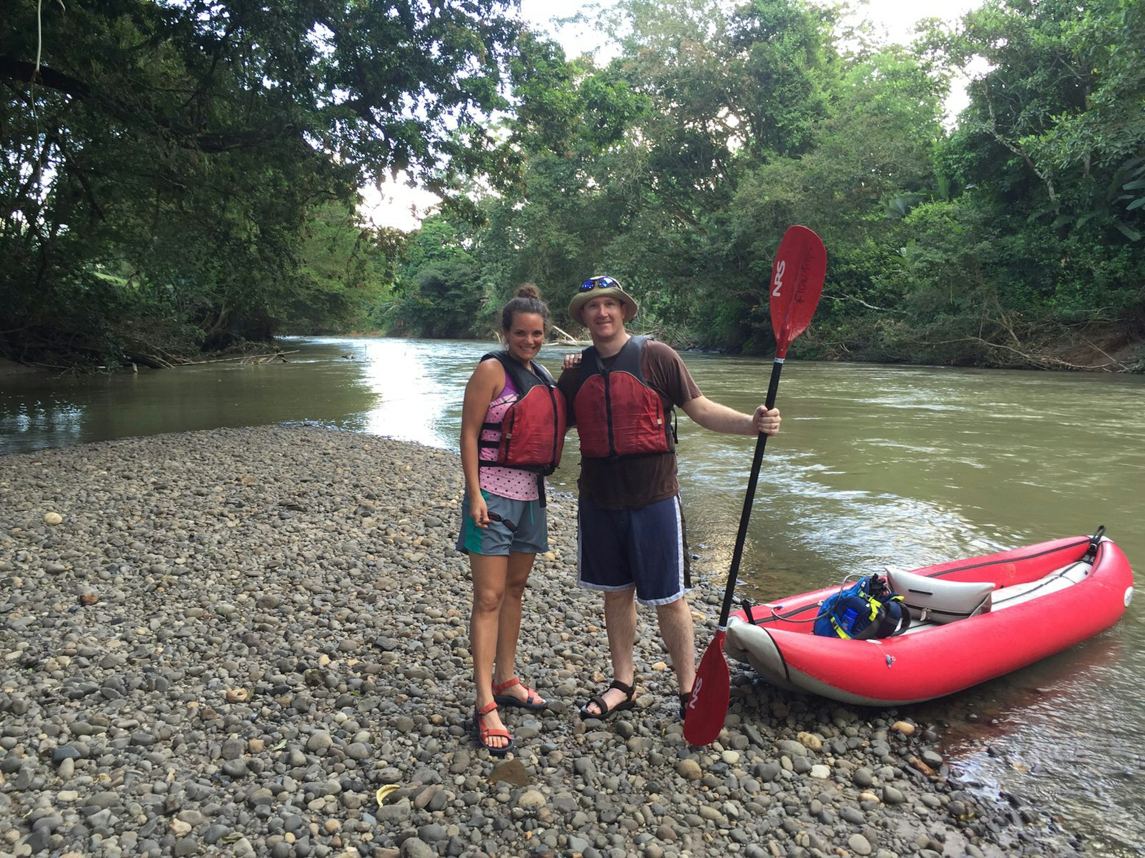 Ben and his new wife pose with an inflatable canoe in Costa Rica.