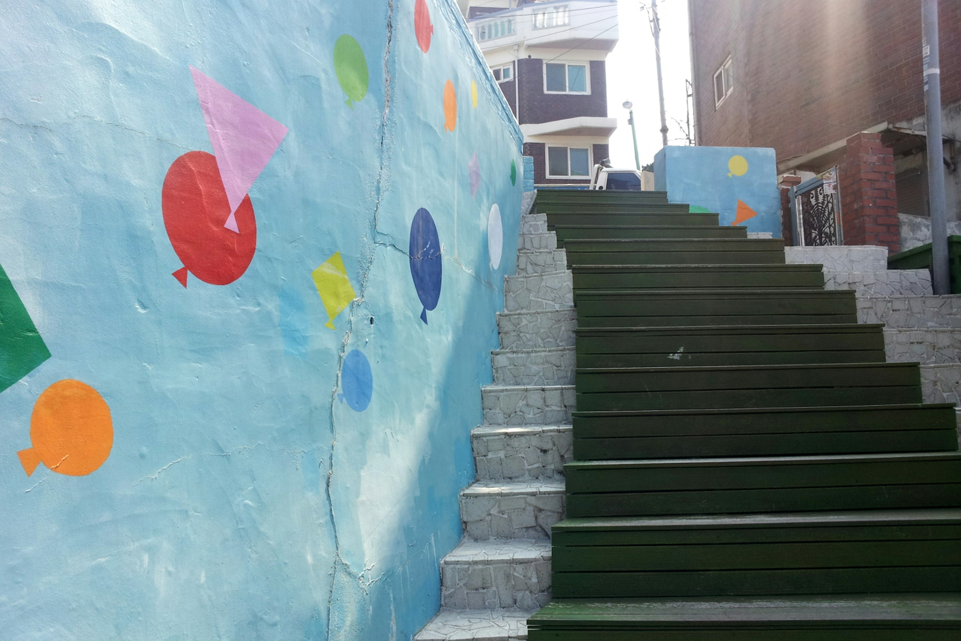 Retro colour: geometric patterns floating up a Jidong staircase. Image by Trent Holden / Lonely Planet