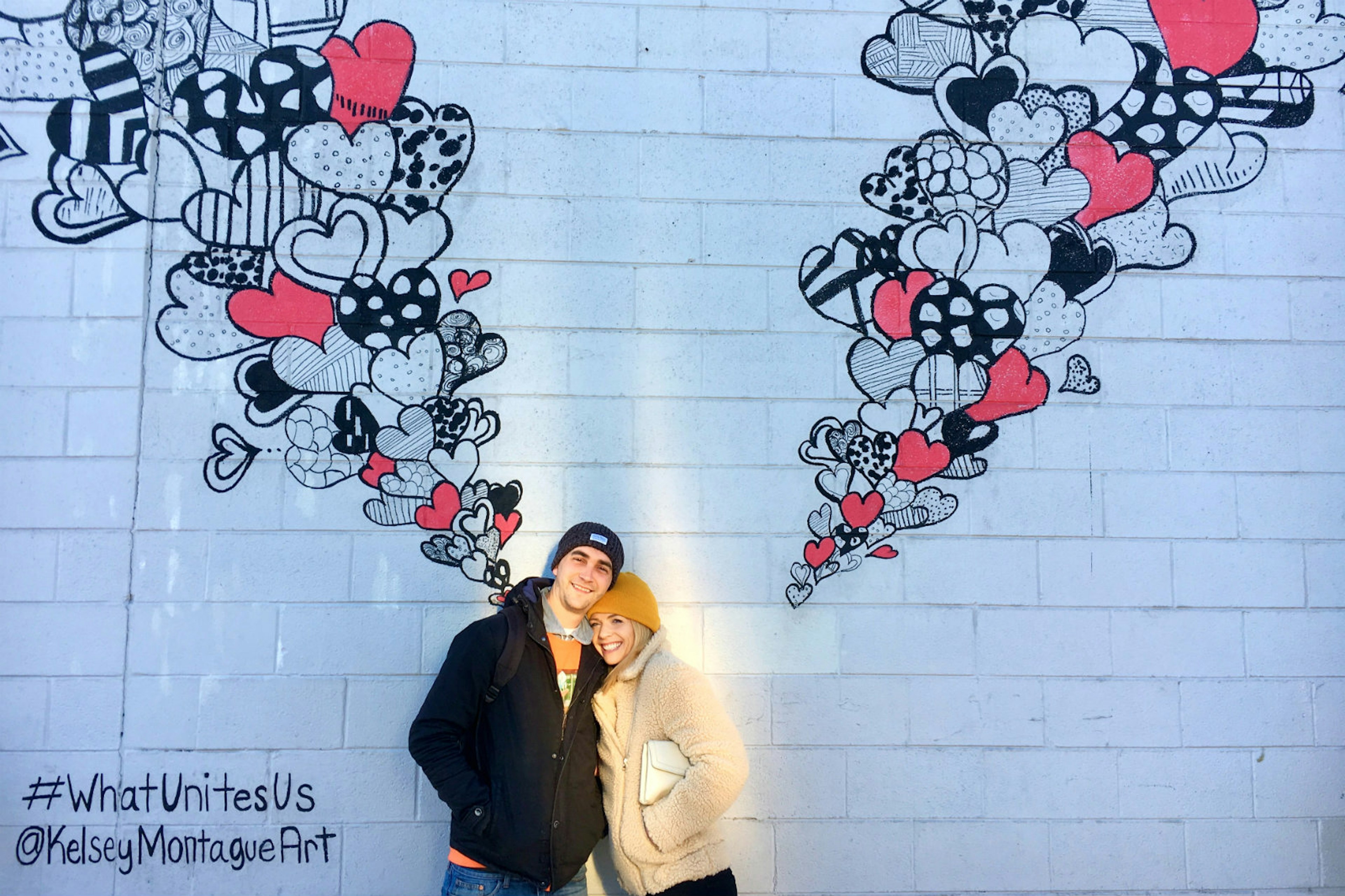 Minimoon magic: a happy couple pose in the RiNo district, Denver © Natalie Nicolson