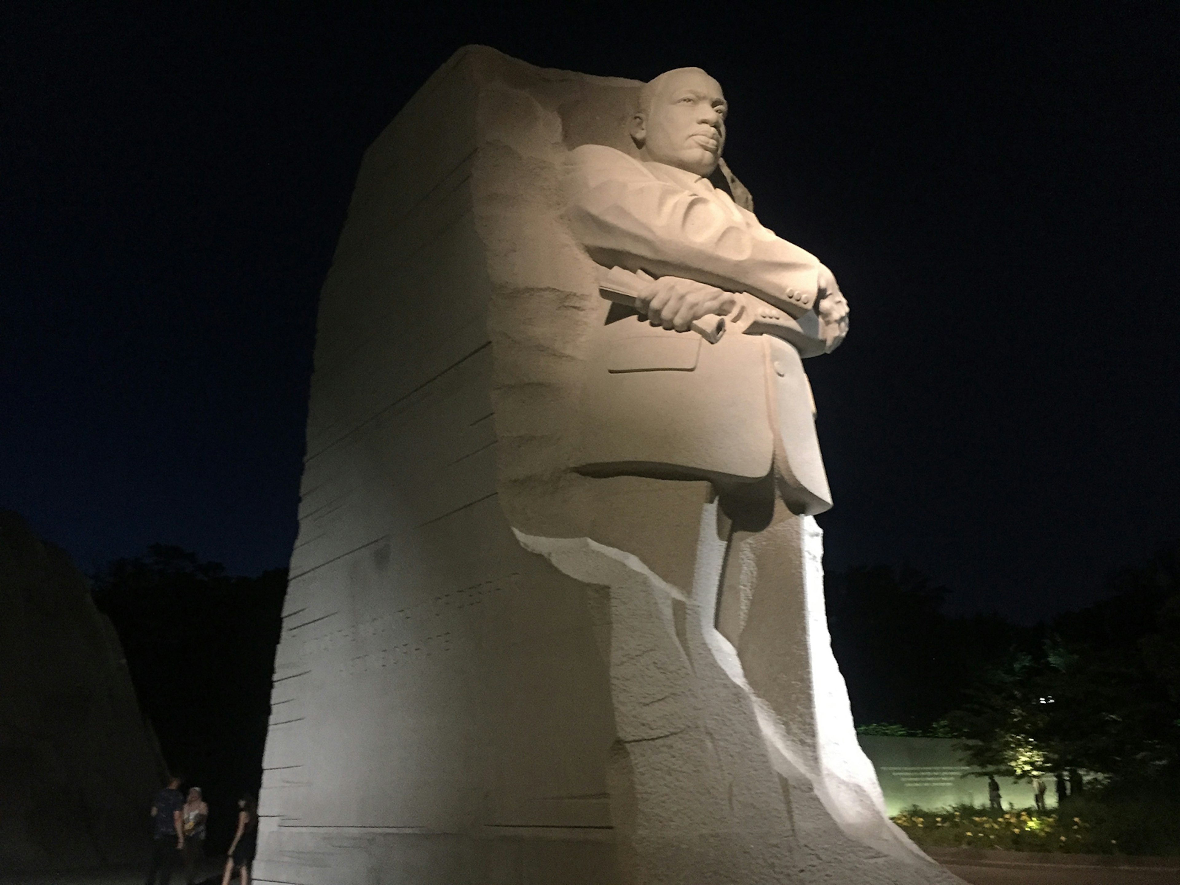 The Martin Luther King, Jr memorial on the National Mall in Washington, DC is presented at night in profile