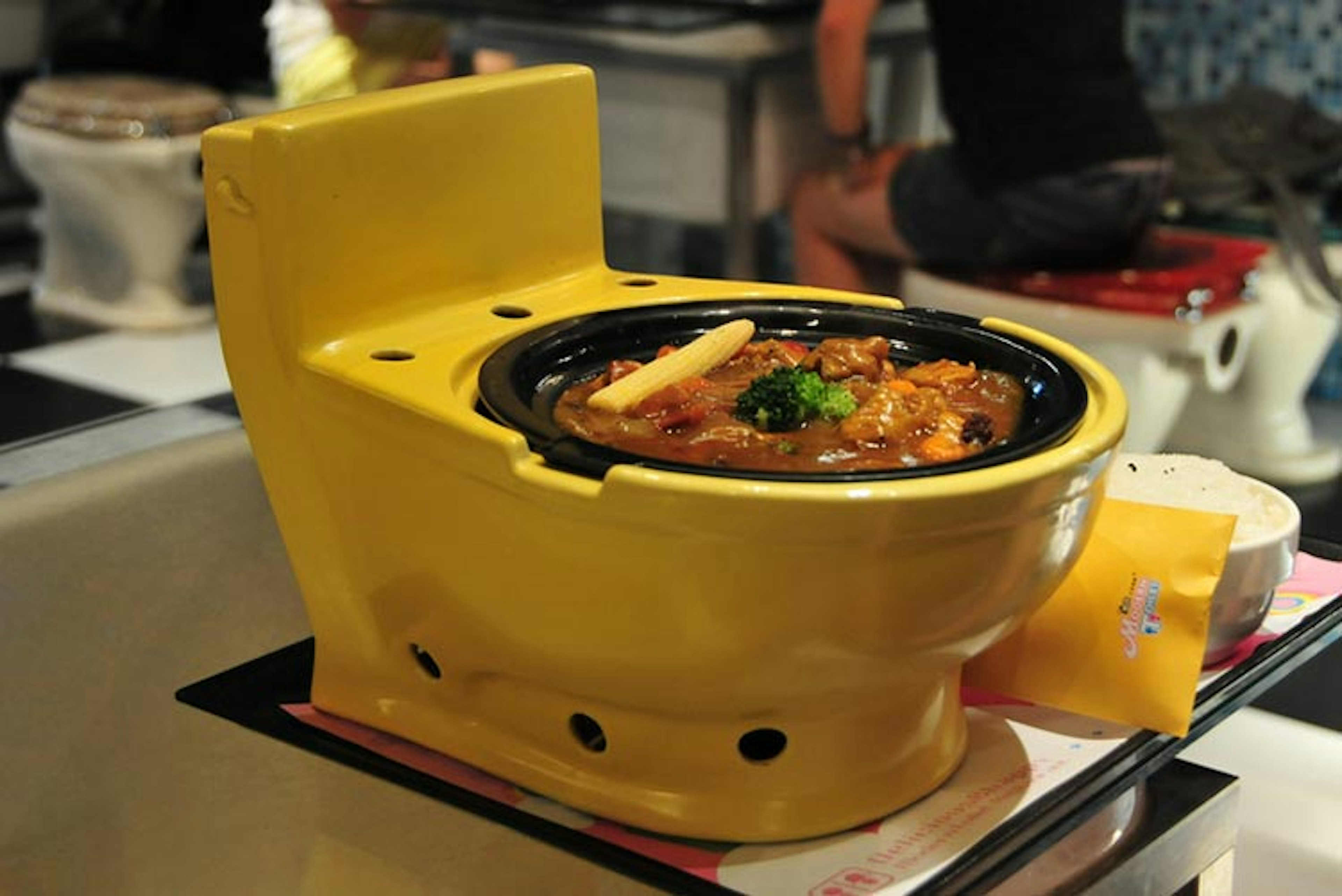 Eye-catching tableware at Modern Toilet restaurant. Image by riNux. CC BY-SA 2.0.