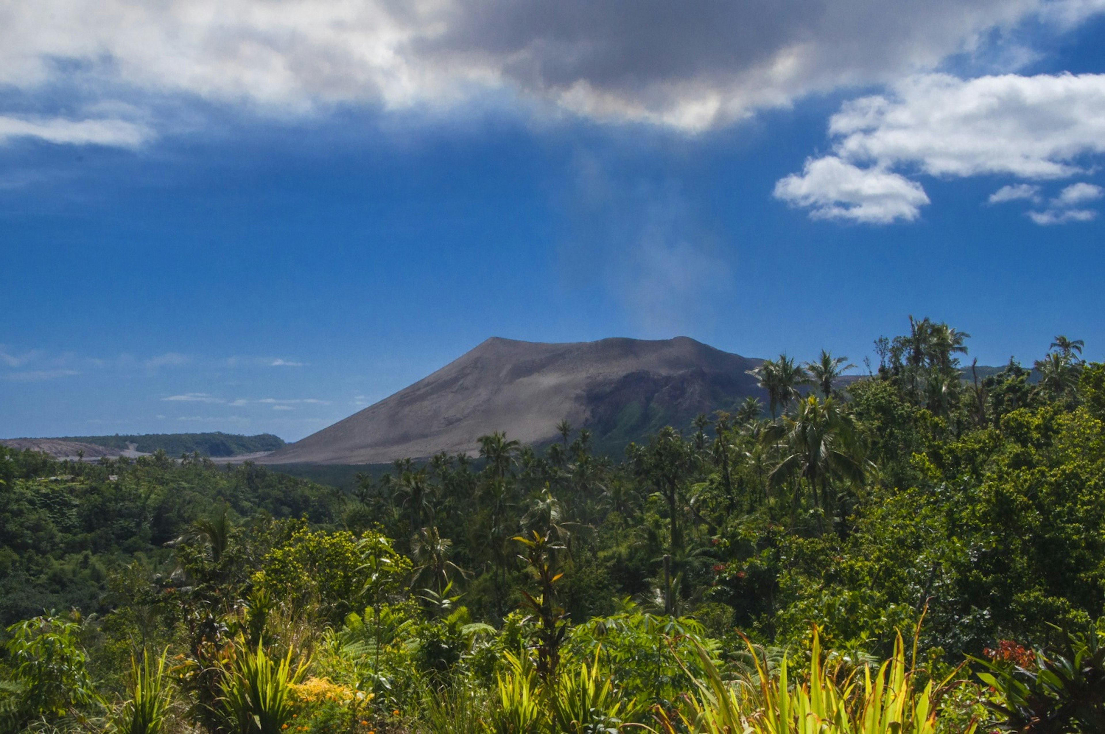 Mt Yasur on the horizon on Tanna ©Paul Harding / Lonely Planet