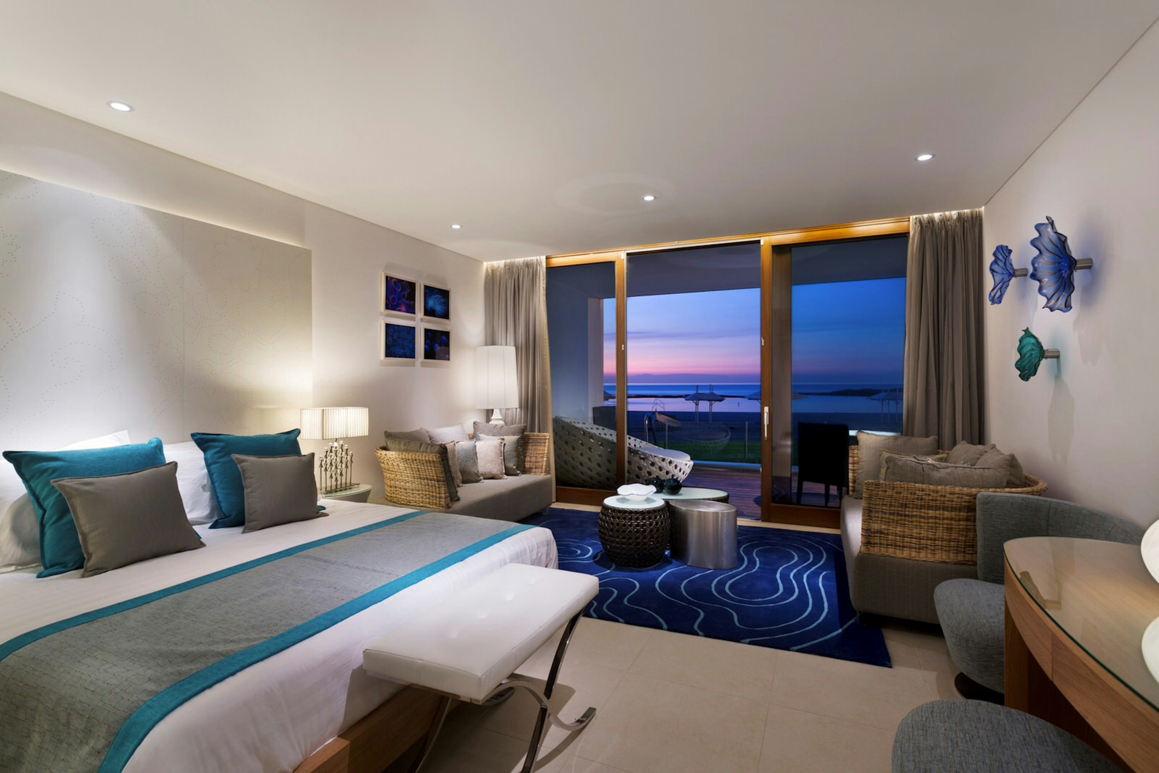 Modern room at Nachsholim Holiday Village with a view of the sea and sunset