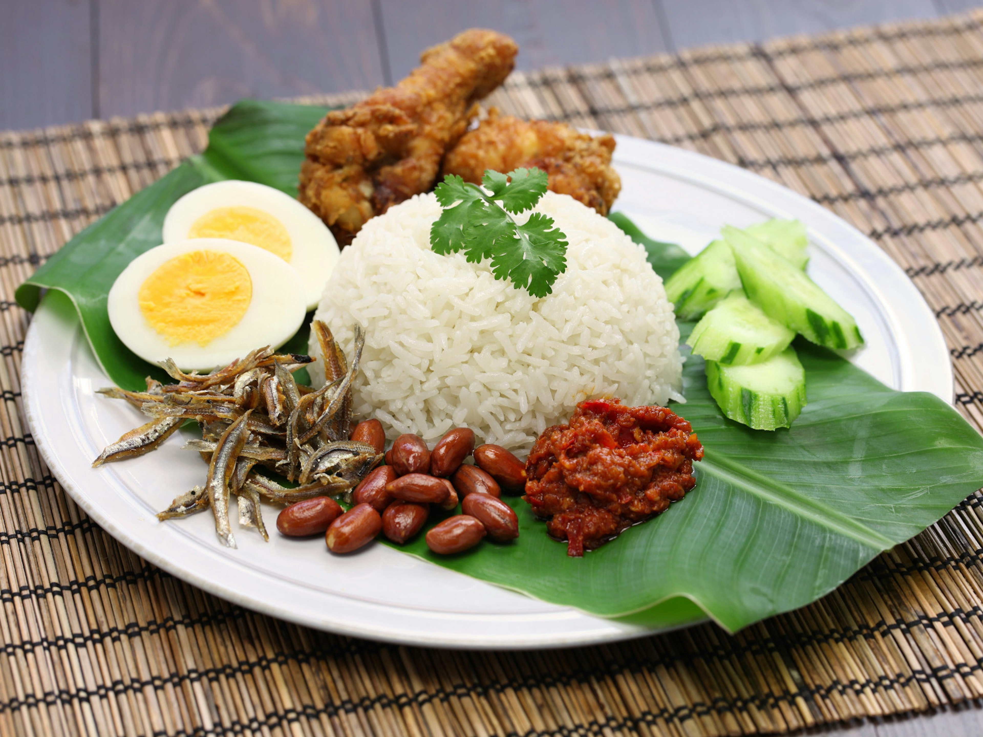 A plate of nasi lemak with coconut milk rice