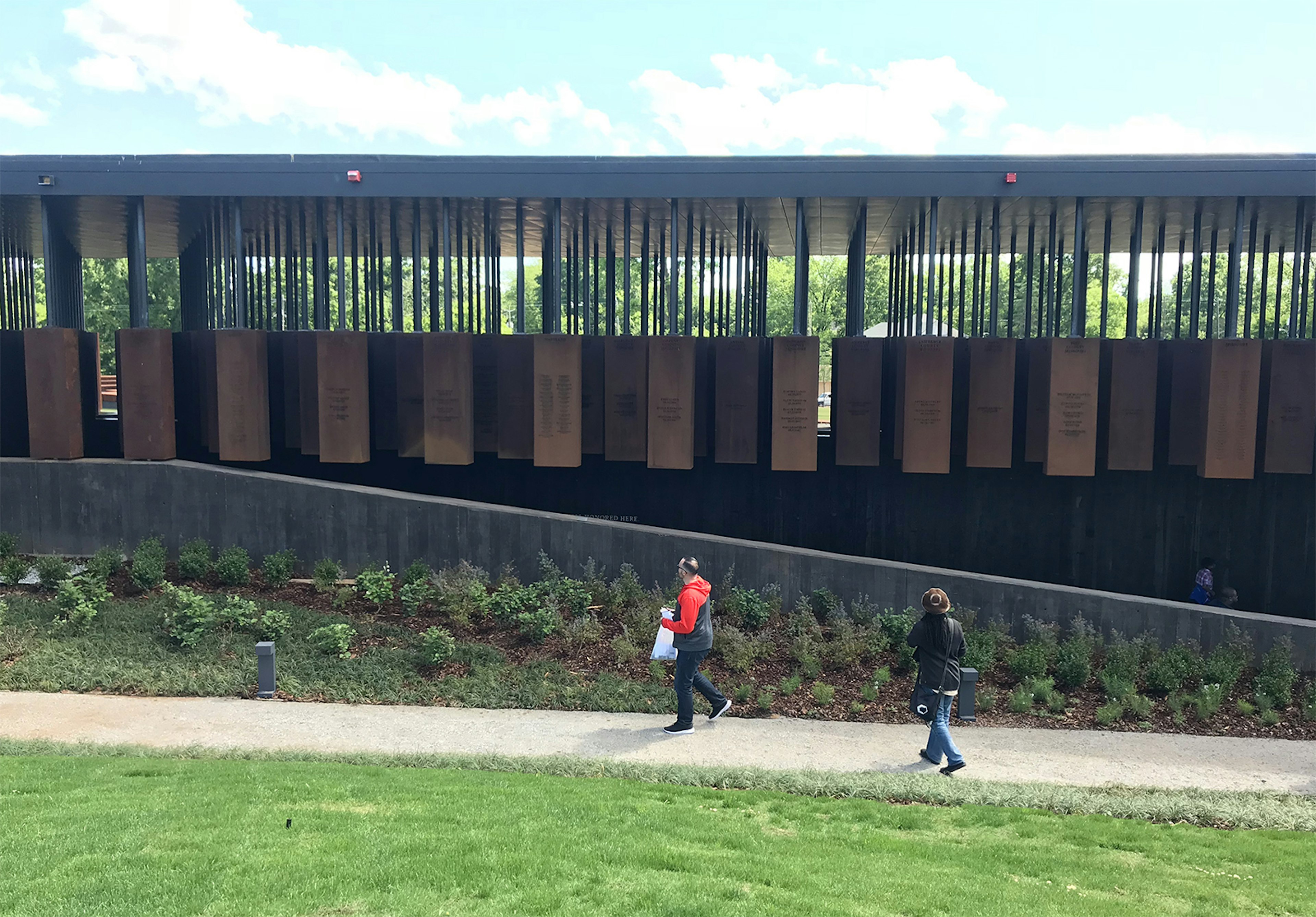 Two people walk outside the National Memorial to Peace and Justice in Montgomery © Carla Jean Whitley / ϰϲʿ¼