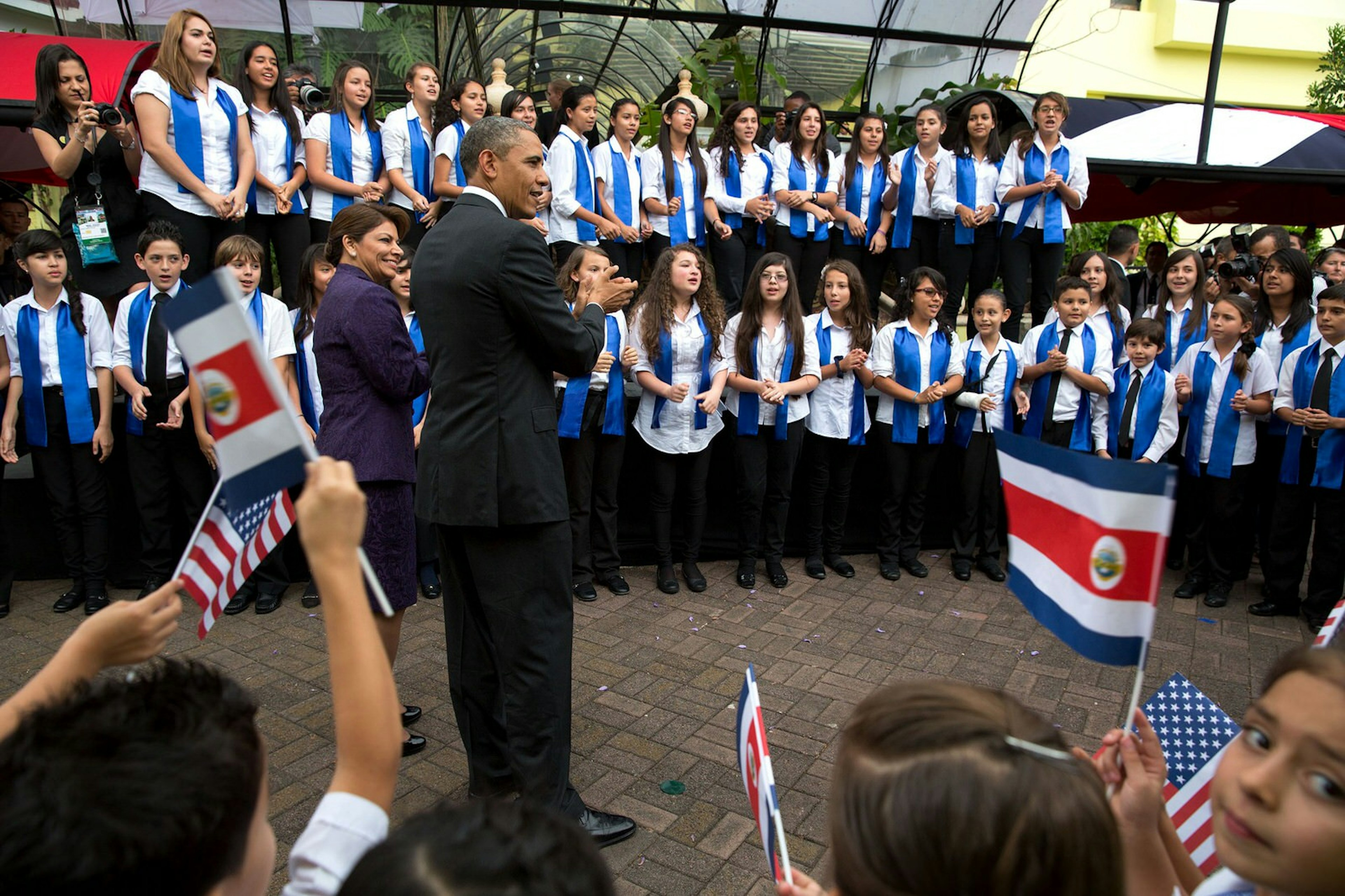 The president participating in a cultural event with Costa Rican youth and former President Laura Chinchilla at Casa Amarilla, San Jose, Costa Rica, May 3, 2013 © Pete Souza / Official White House Photo