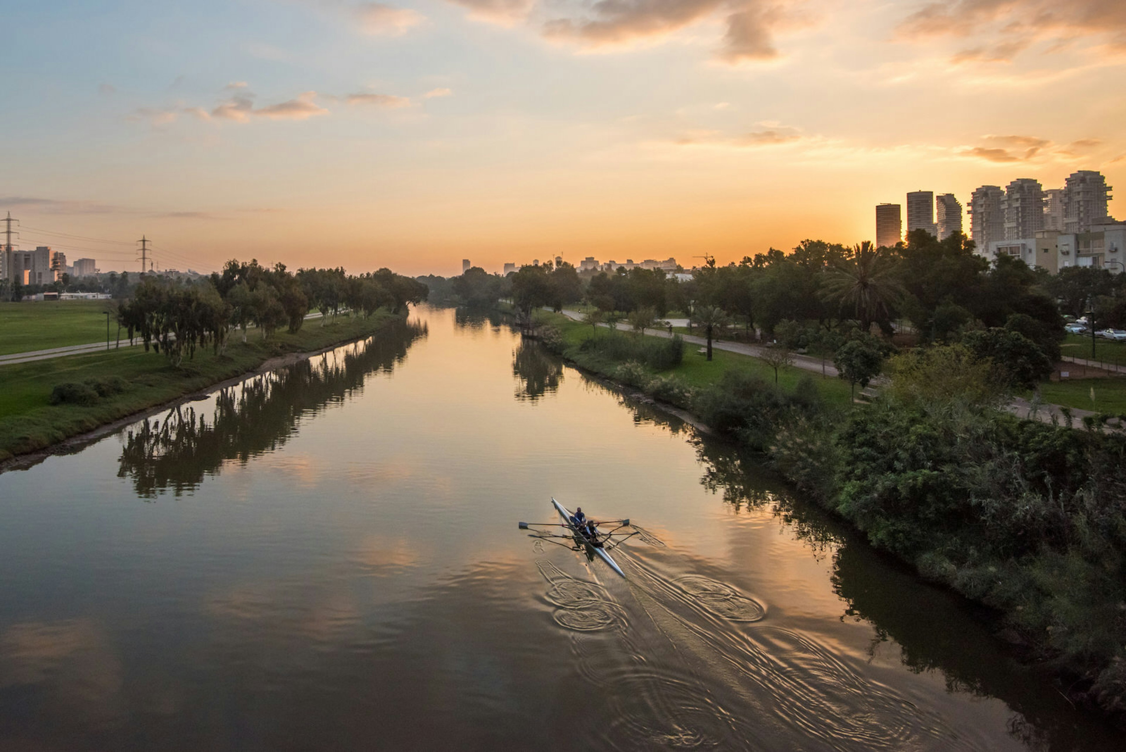 Kayakers paddle through the Yarkon River by Park HaYarkon, which runs through the heart of Tel Aviv.