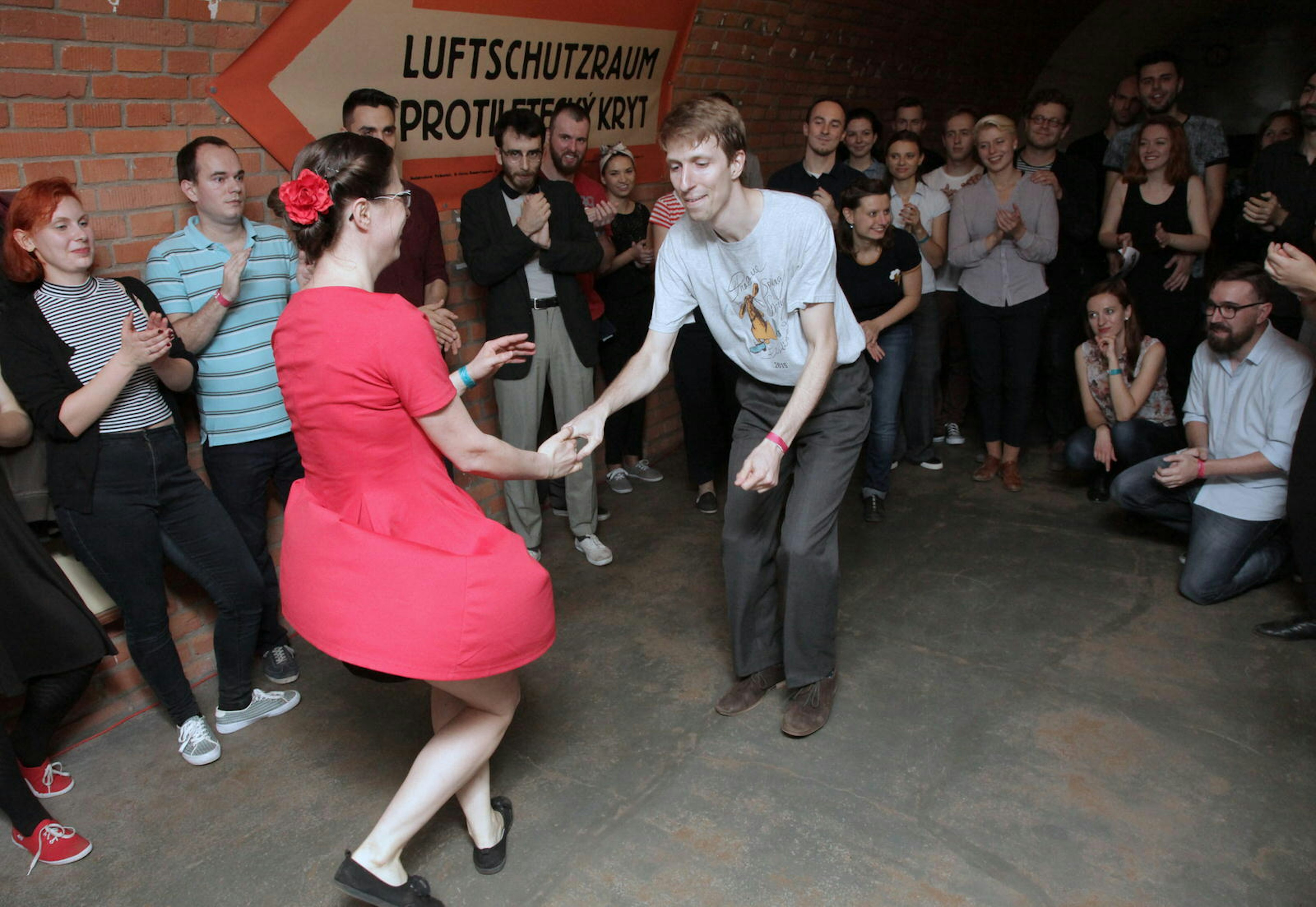 A couple dance in the darkened tunnels of 10-Z Bunker hostel