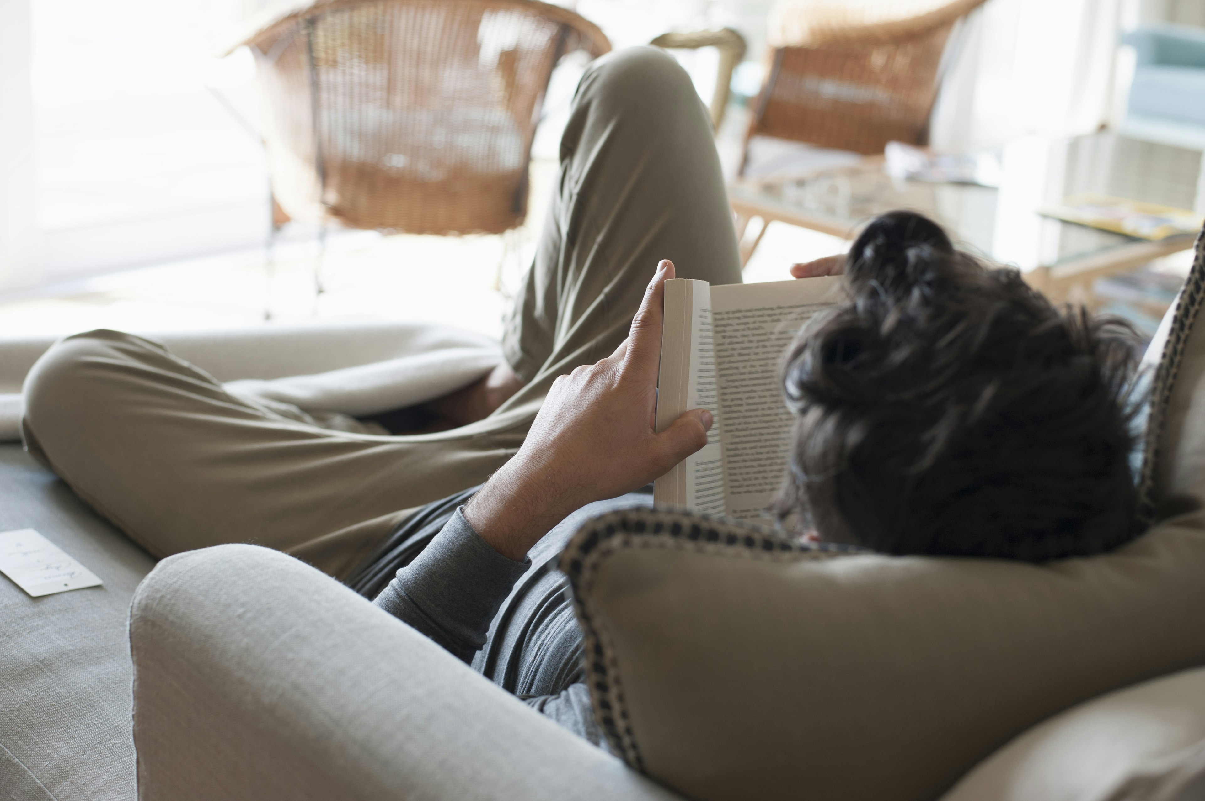 A person relaxing reading a book