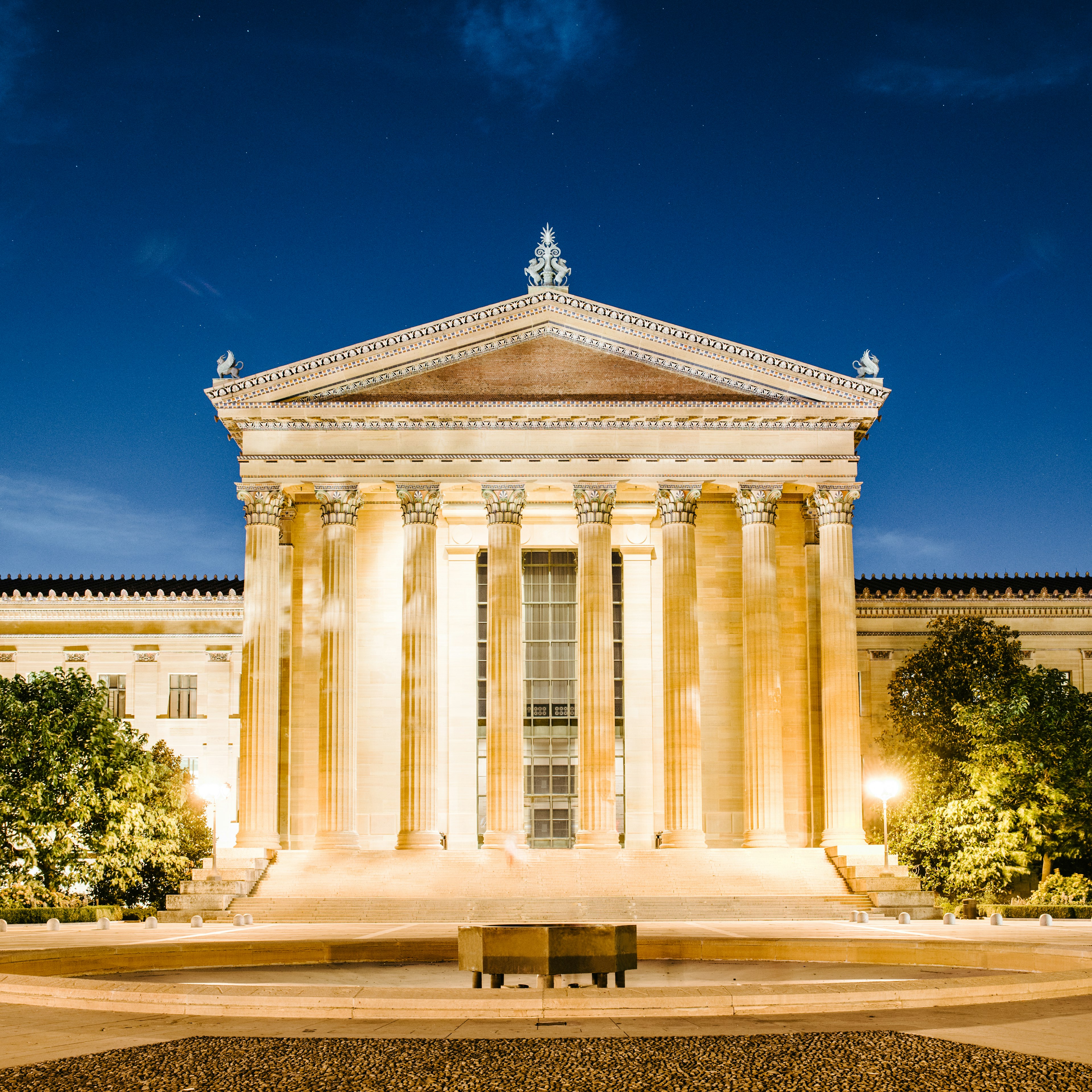 Exterior of the Philadelphia Art Museum entrance at night.