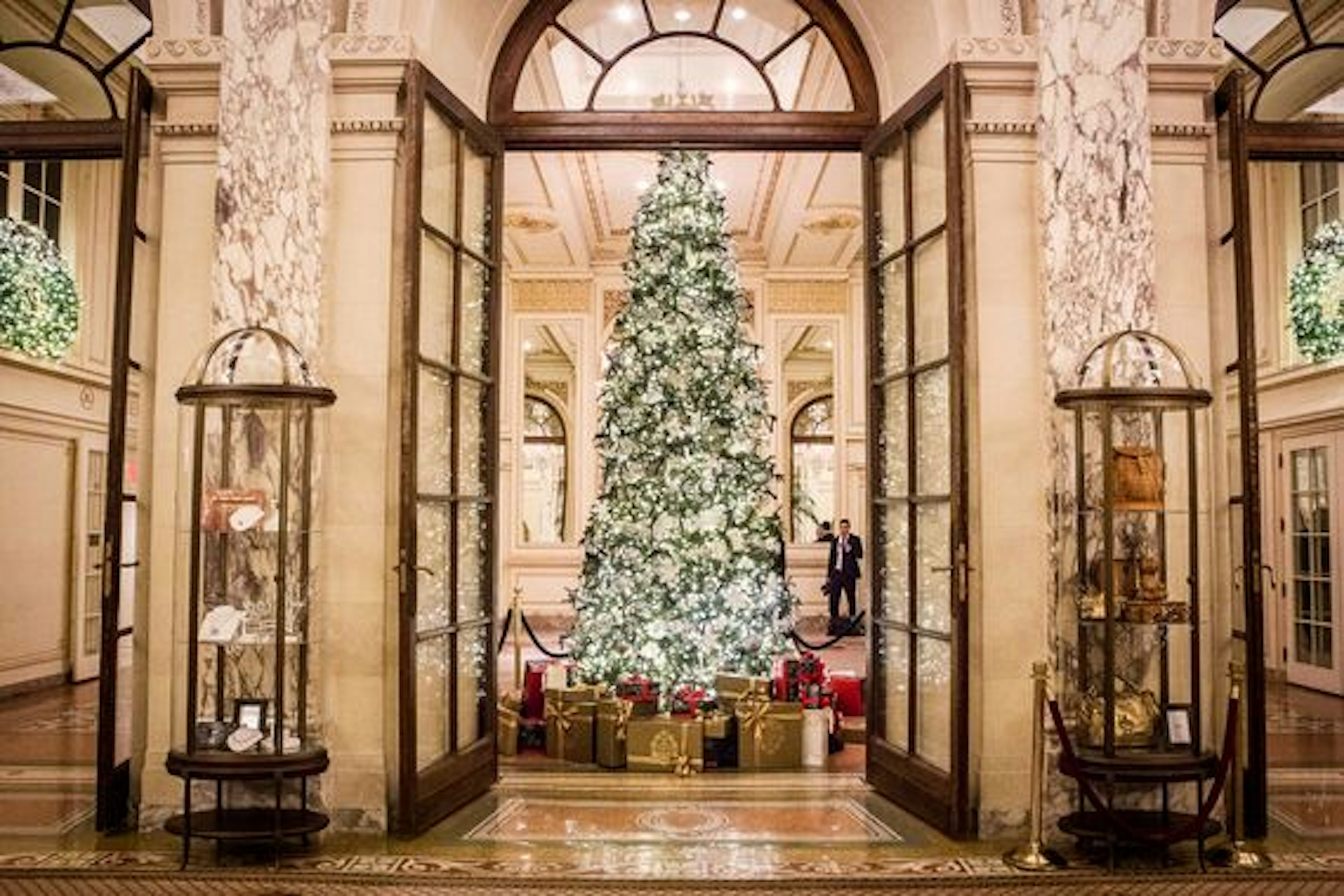 A giant Christmas tree framed by an art deco door