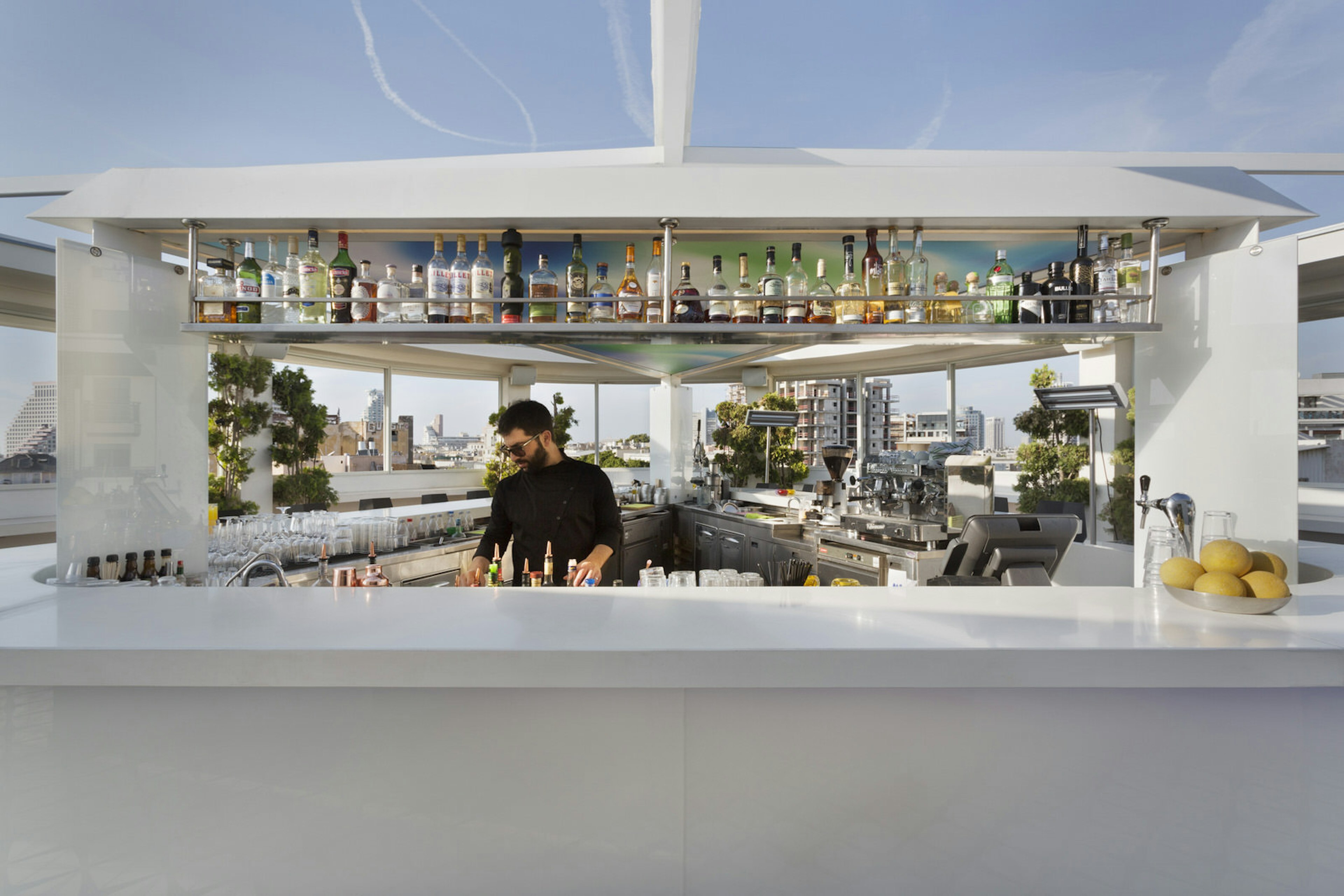 Bartender and bar on the roof of Poli House Hotel, Tel Aviv, Israel © Poli House Hotel