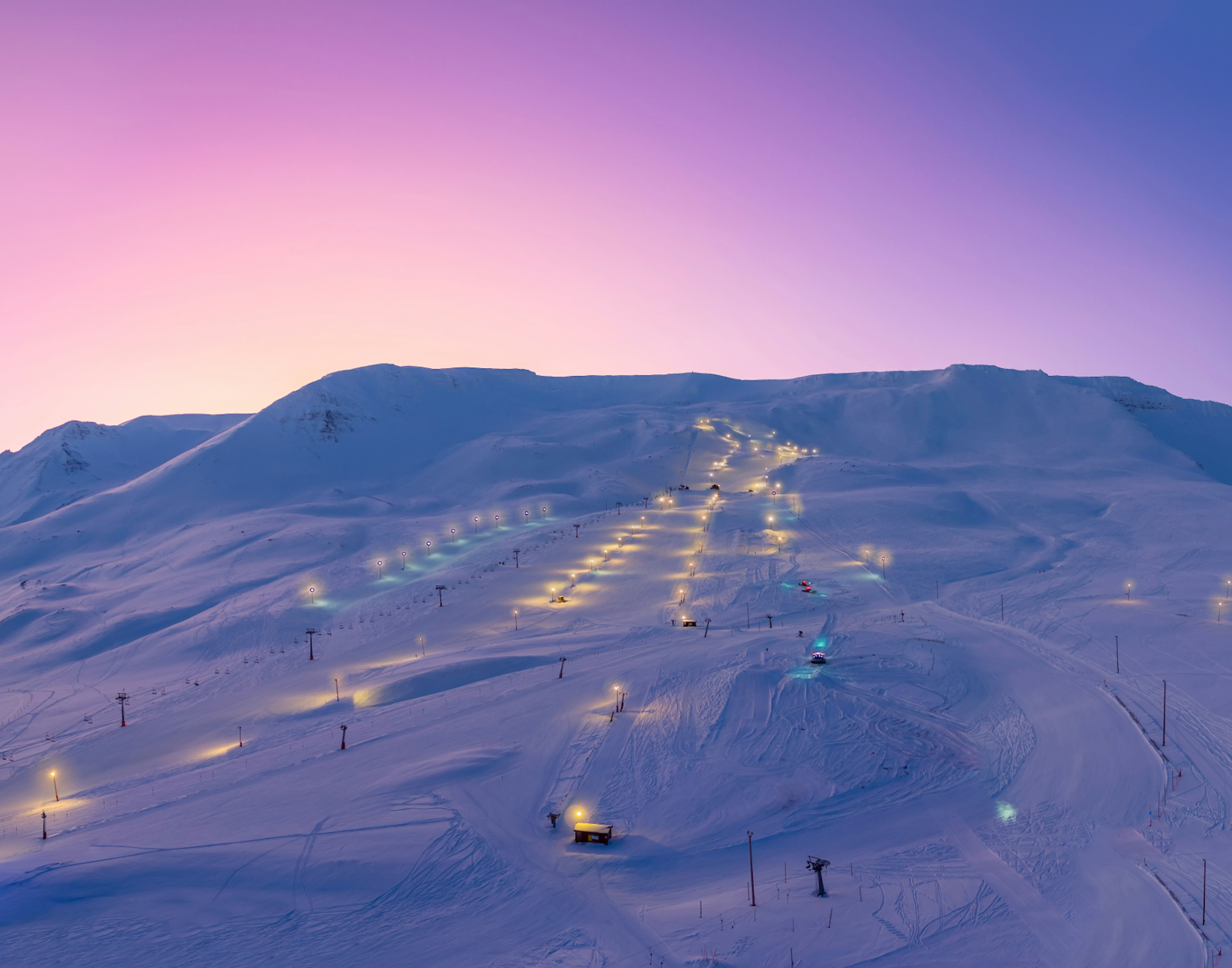 a-beautiful-purple-sky-backs-the-Hlíðarfjall-Ski-Centre-slope-outside-of-Akureyri-North-Iceland