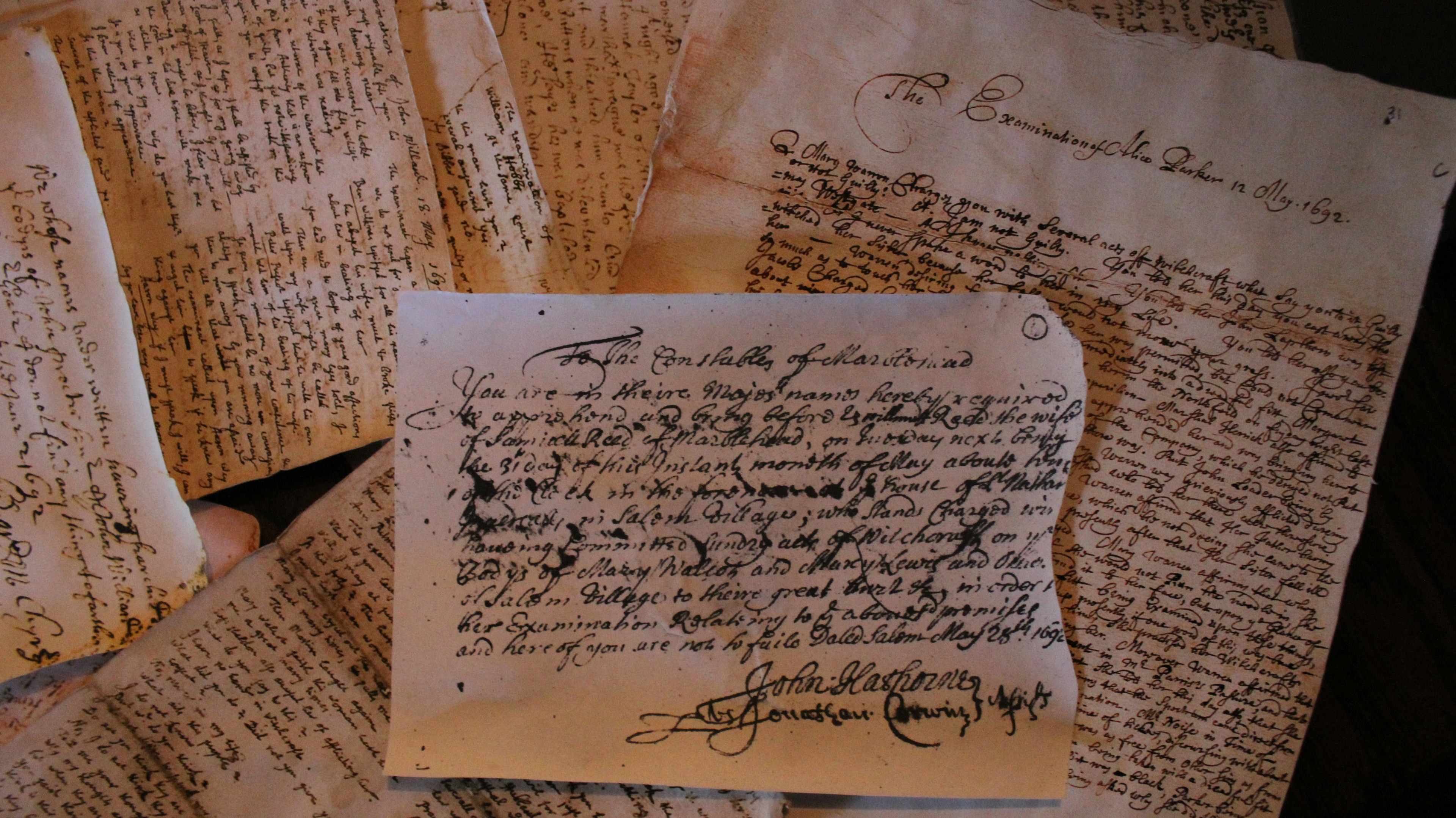 A pile of very old handwritten documents dating from 1692