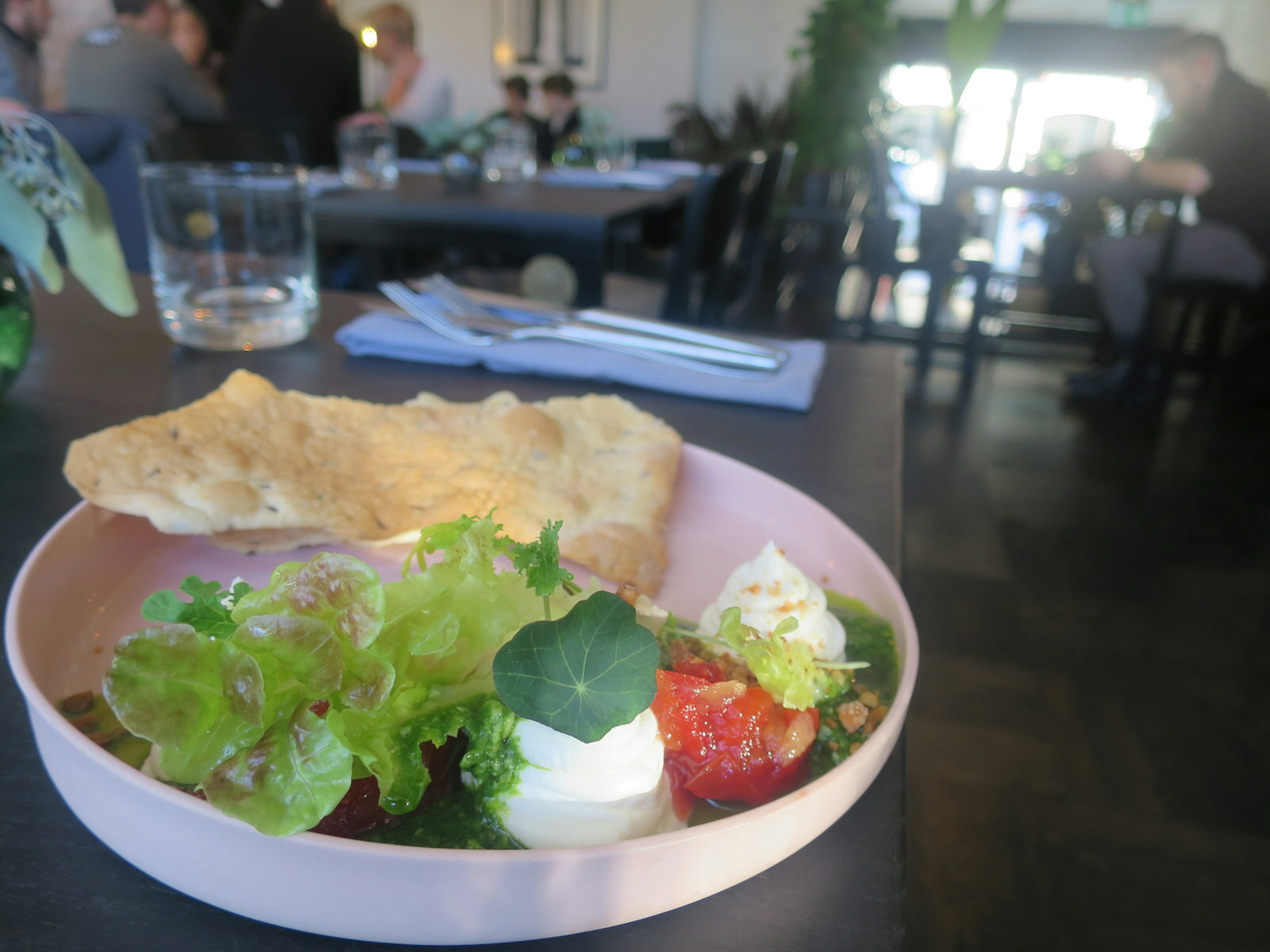 Estonian goat cheese cream, with tomato-ginger chutney, cumin flat bread and fresh pesto at Tallinn's Sfäär restaurant © Karyn Noble / iBestTravel