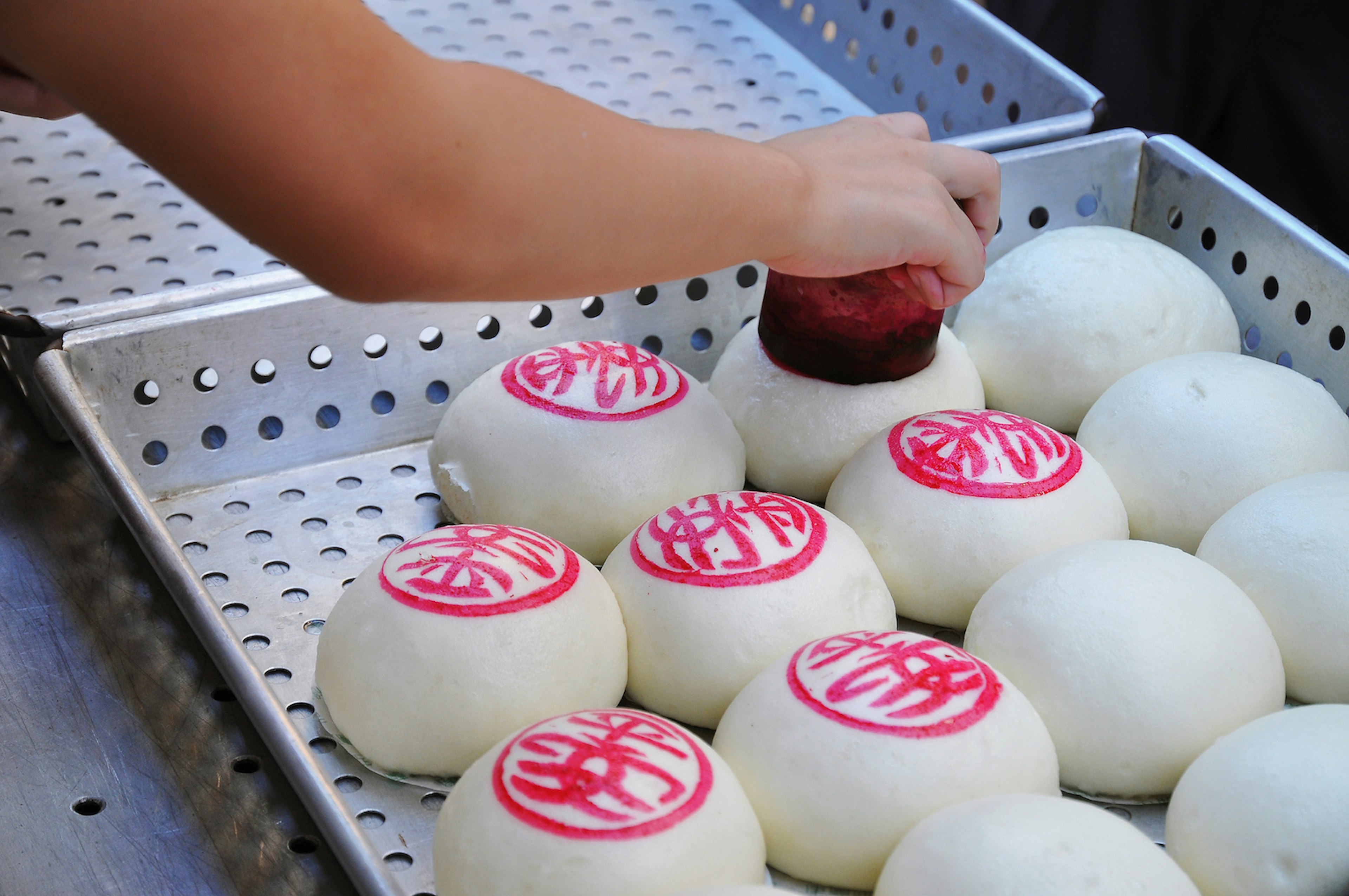 A selection of white bao in a tray