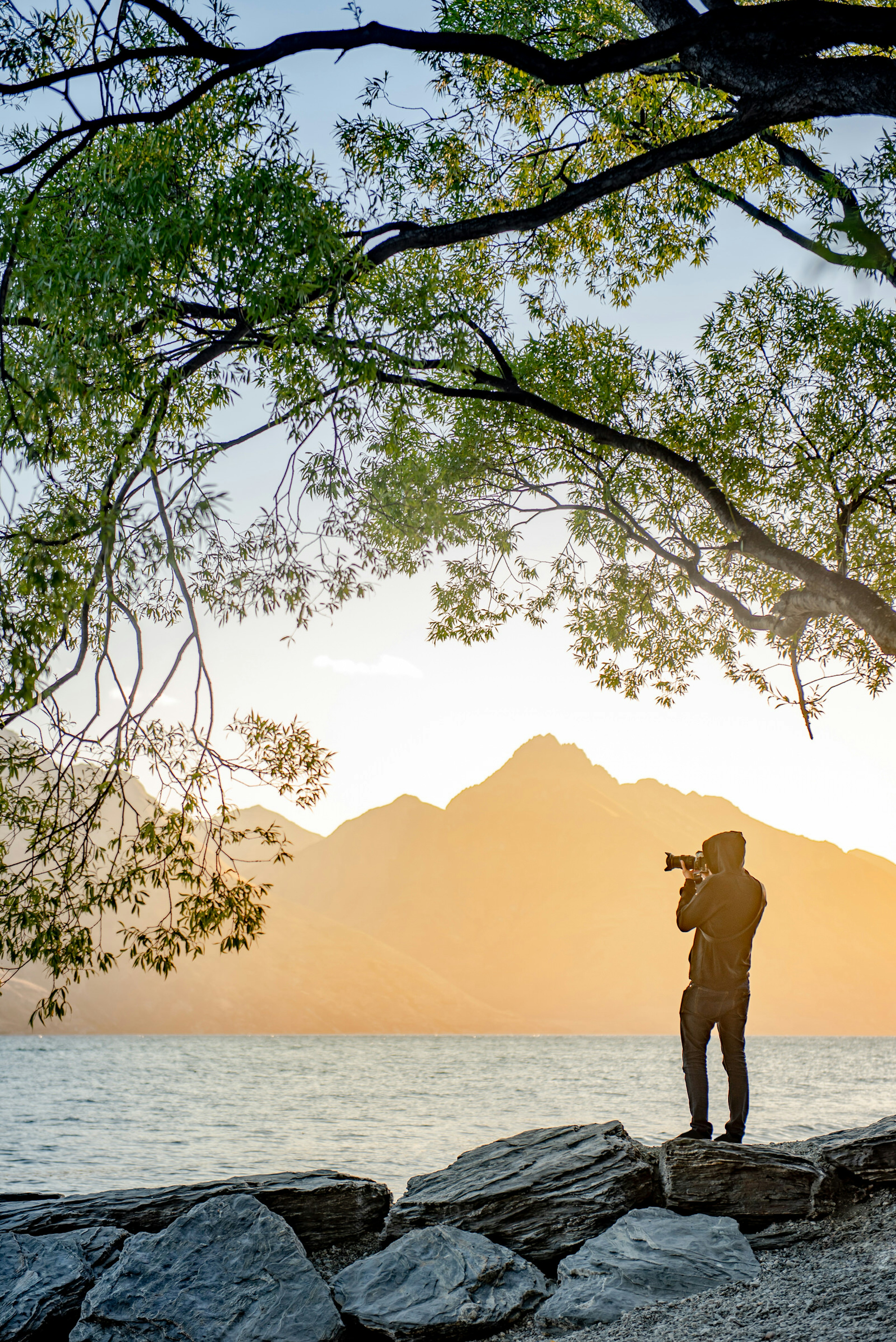 A photographer captures a body of water as the sun goes down