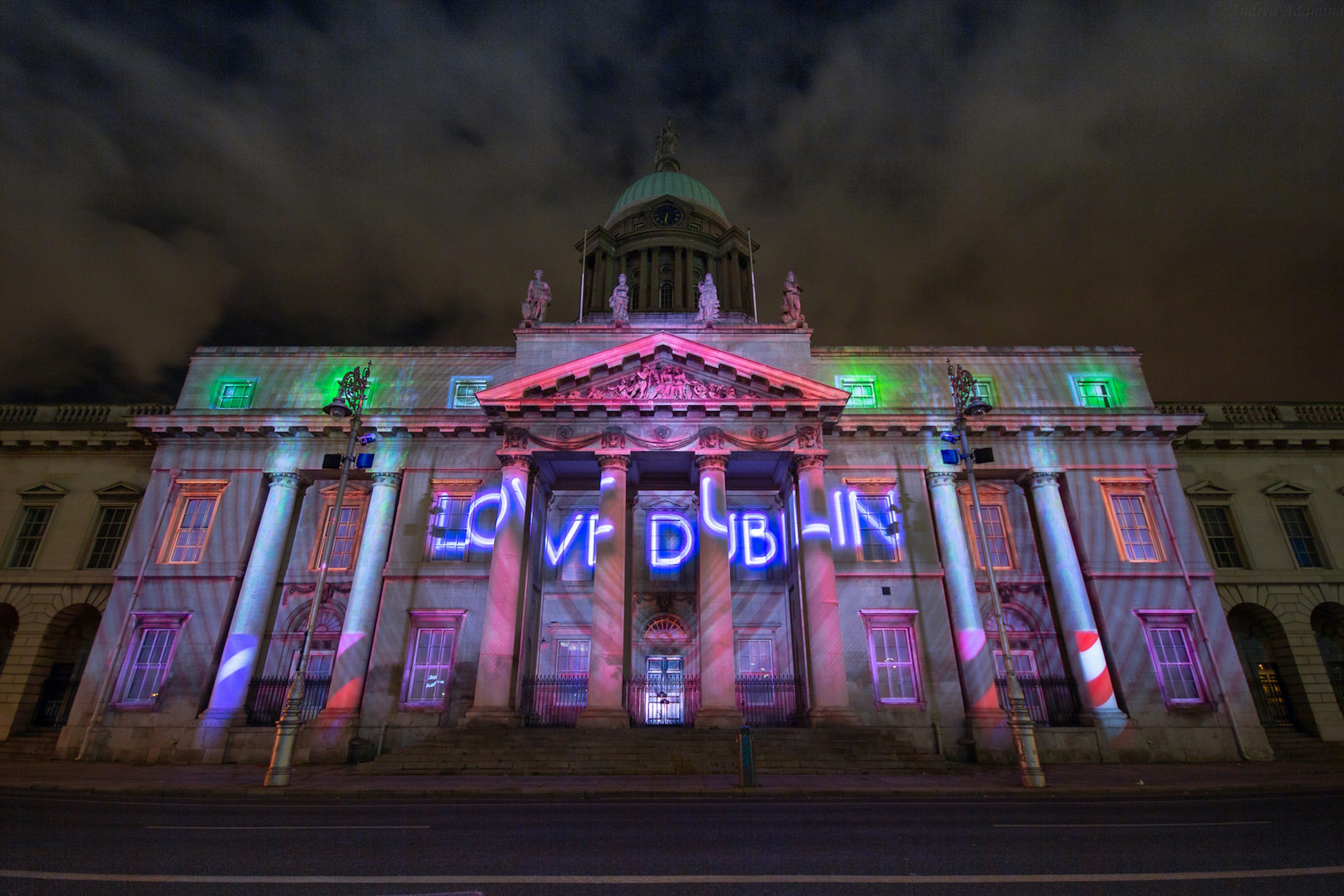 Custom House, Dublin at New Years. The renaissance-style building is illuminated by a light projection that reads 'LOVE DUBLIN' in a large heart.