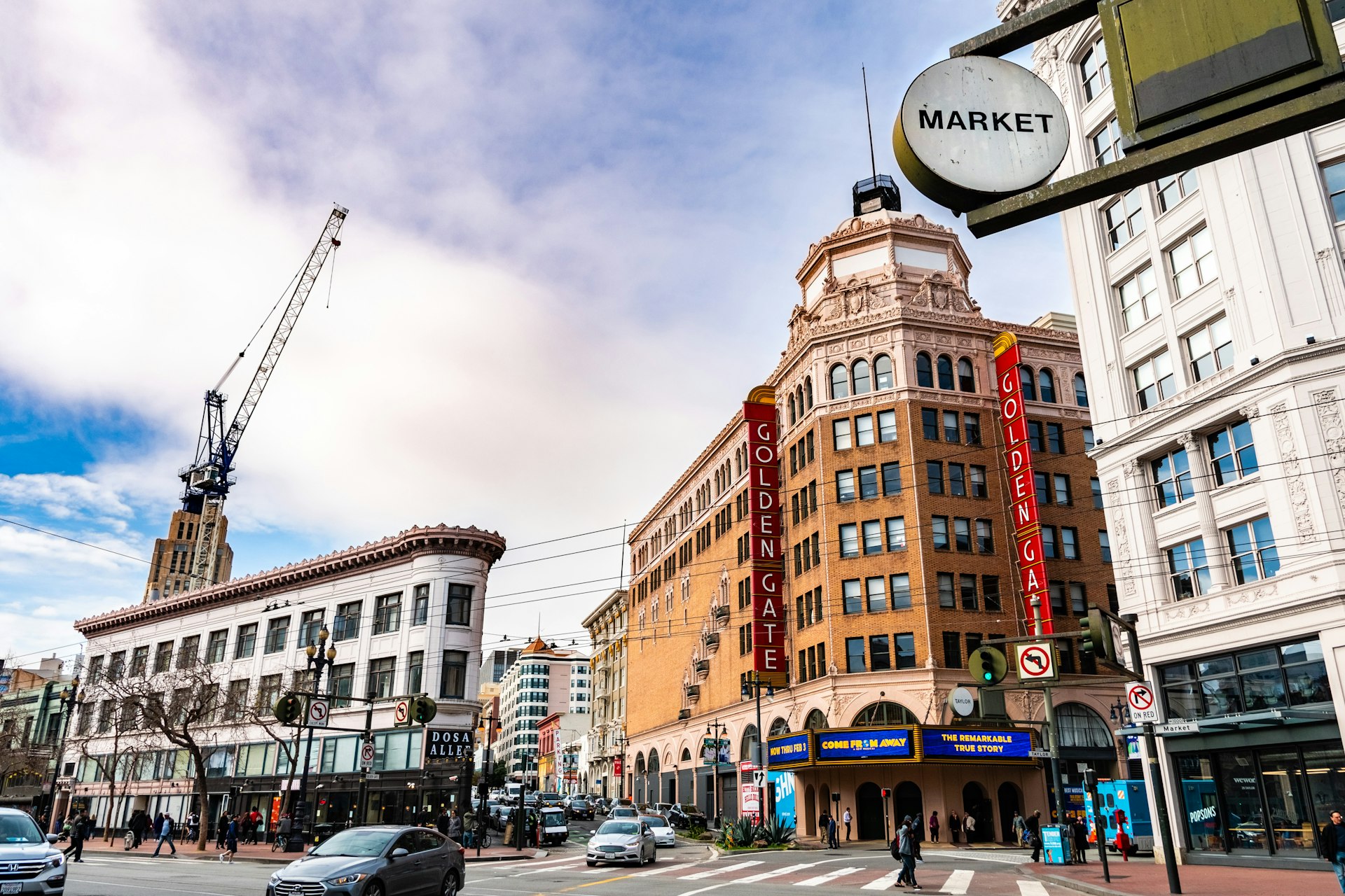 An intersection of streets in a busy city neighborhood