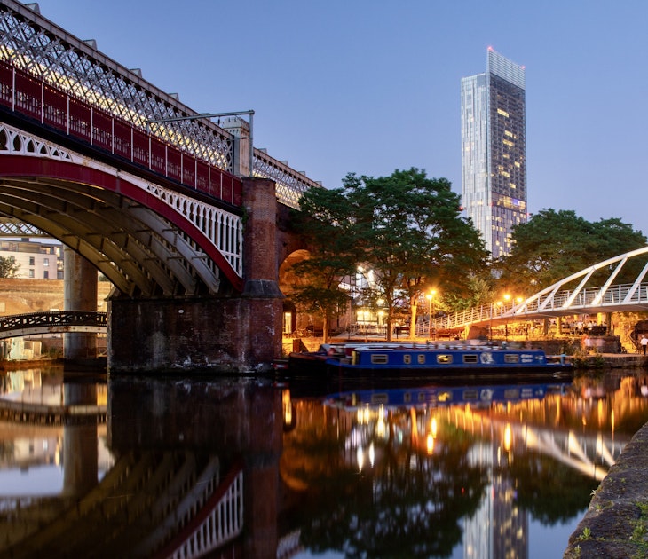 Manchester, England, UK - June 30, 2018: Houseboats light up in Castlefield Basin as dusk falls on Manchester City Centre, with a Metrolink tram passing on a viaduct.; Shutterstock ID 1443654122; purchase_order: 65050; job: Lonely Planet Online Editorial; client: Perfect day in Manchester; other: Brian Healy
1443654122
architecture, beetham tower, boat, bridge, bridgewater canal, britain, british, building, canal, canal boat, castlefield, castlefield basin, cheshire lines committee, cityscape, construction, crane, deansgate square, dusk, england, english, evening, great britain, greater manchester, industrial, lancashire, liverpool to manchester line, manchester, manchester metrolink, narrow boat, narrowboat, night, railway, reflection, skyscraper, stone, streetcar, tower, tower crane, towpath, tram, transport, transportation, travel, uk, united kingdom, urban, vehicle, viaduct, water, waterway
Manchester, England, UK: Houseboats light up in Castlefield Basin as dusk falls on Manchester City Centre, with a Metrolink tram passing on a viaduct.