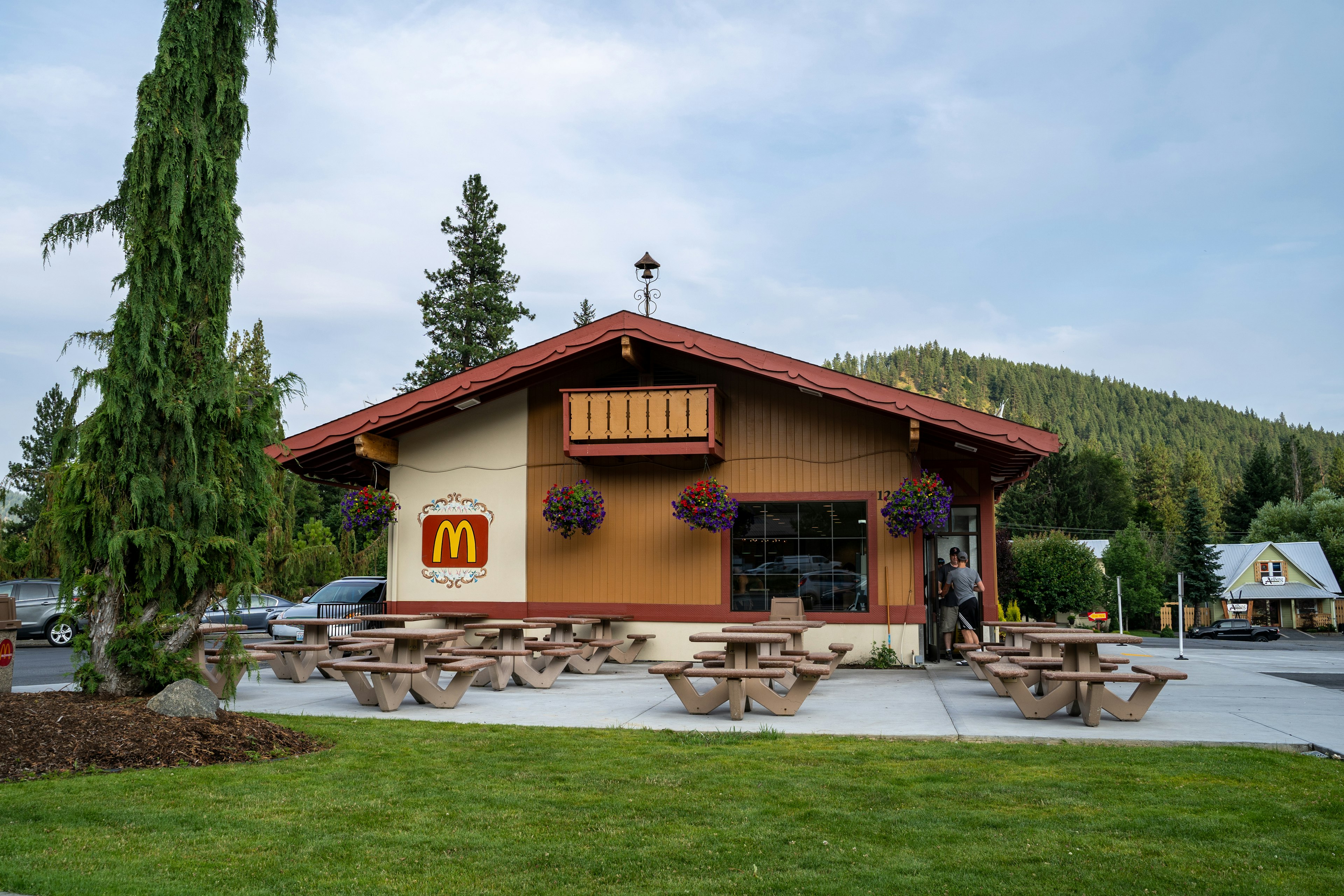 xterior of a McDonalds fast food restaurant. The architecture has Bavarian German theme of the town