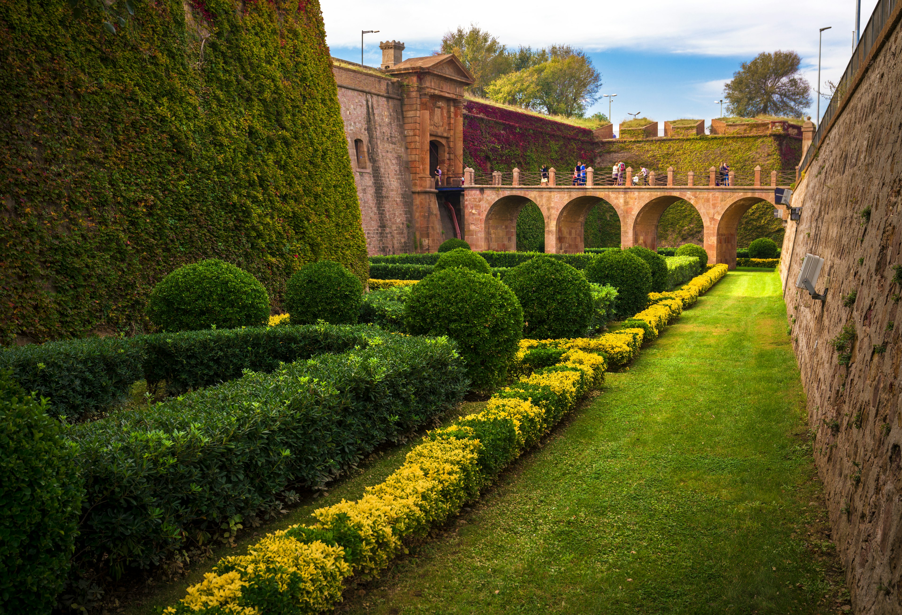 Explore the lush garden surrounding Castell de Montjuïc in spring. Shutterstock