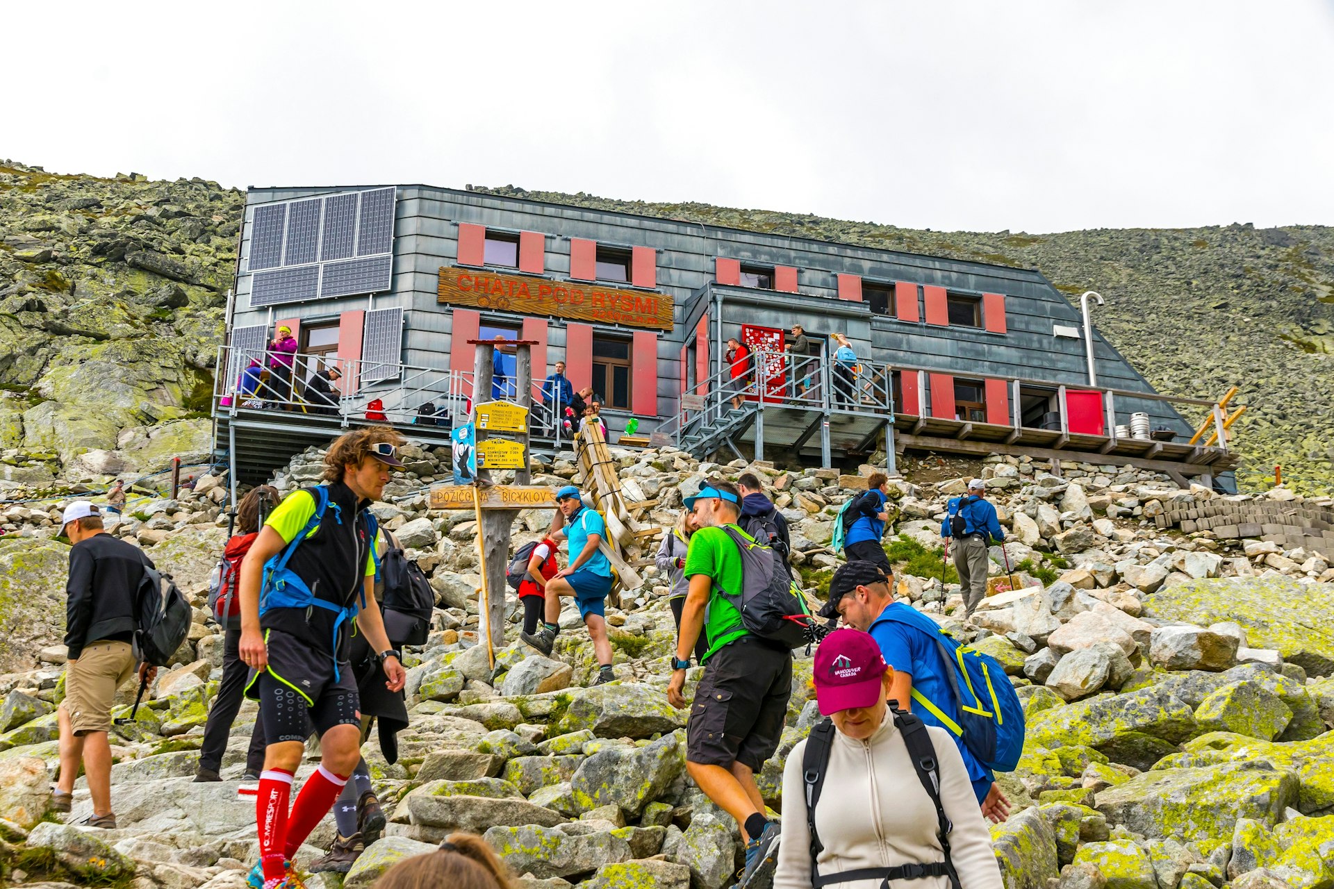 People climb the hill near Chata pod Rysmi, the highest mountain hut in High Tatras (2250m), Slovakia