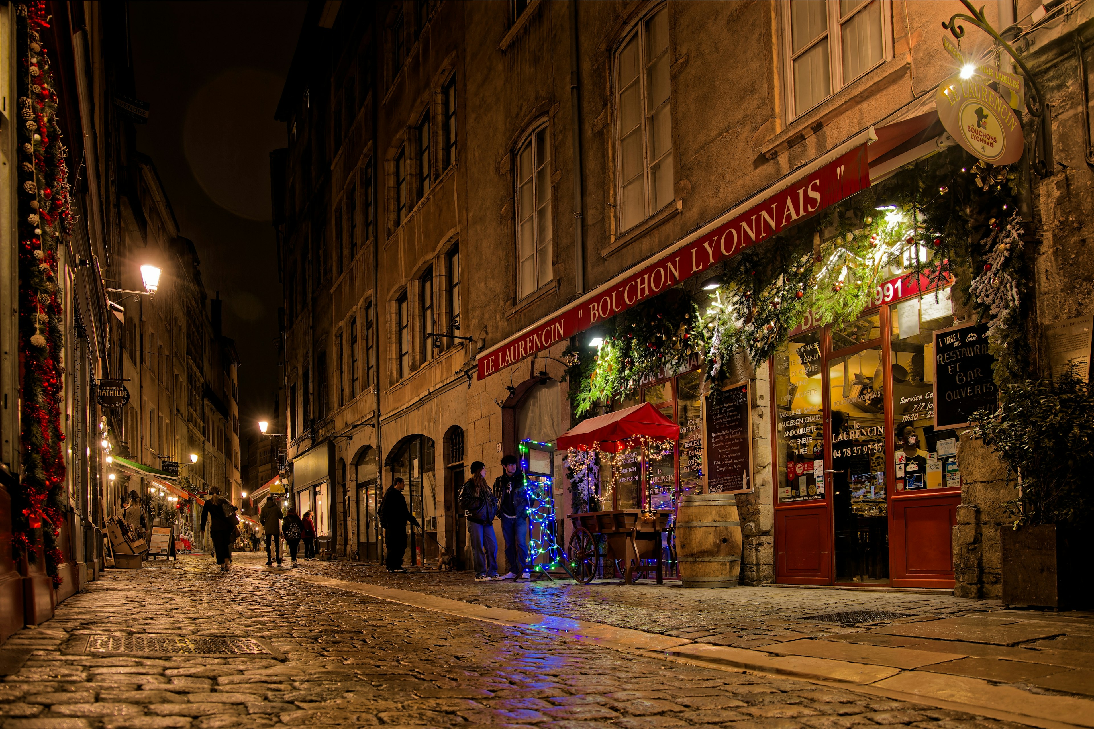 Night on Rue Saint-Jean, a well-known street for its numerous bouchons lyonnais, traditional restaurants of the city, Lyon, France