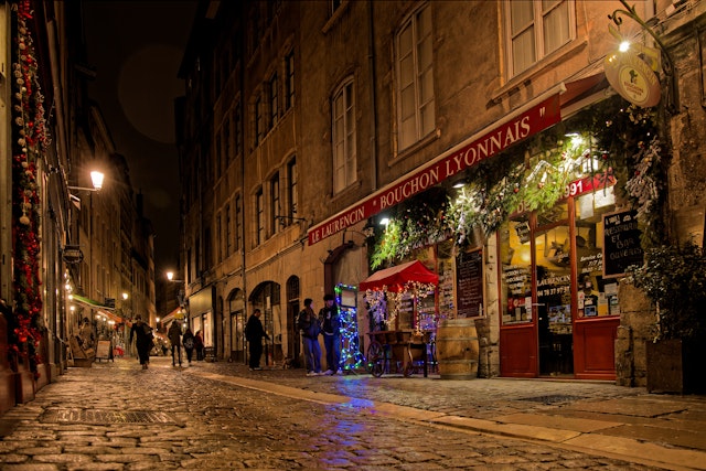 Night on Rue Saint-Jean, a well-known street for its numerous bouchons lyonnais, traditional restaurants of the city, Lyon, France