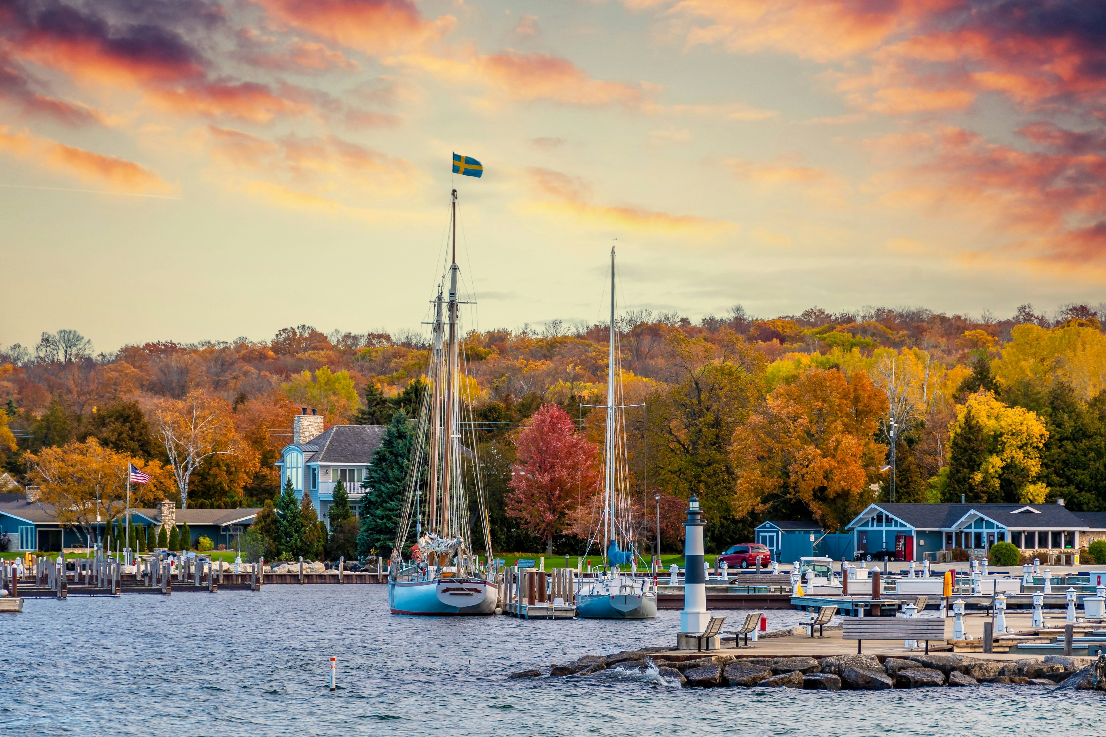 Charming harbor town with autumn trees