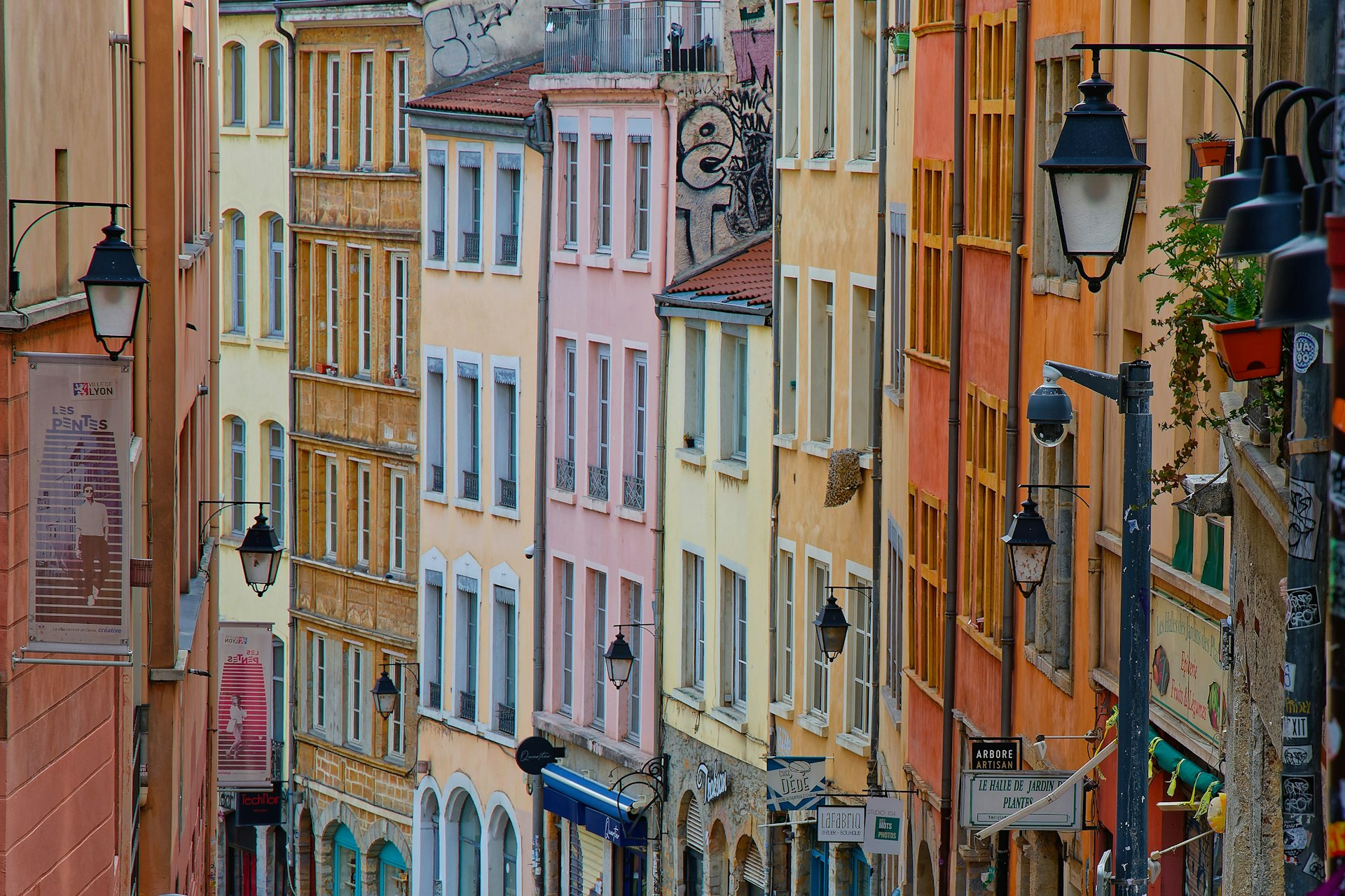 Colorful buildings on a sloping street in the Pentes de la Croix Rousse area of Lyon