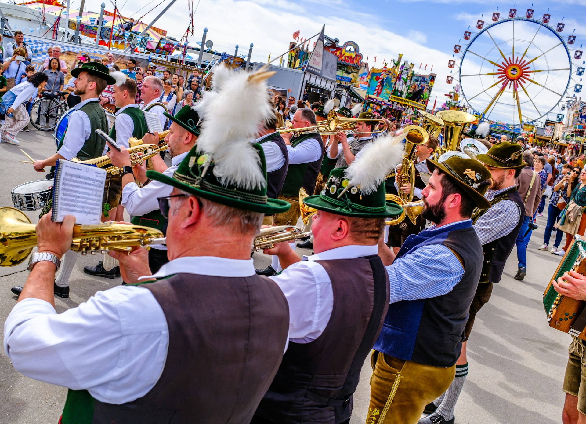 Participants in traditional Bavarian dress play trumpets to kick off Frühlingsfest (Spring Festival) in Munich, Bavaria, Germany