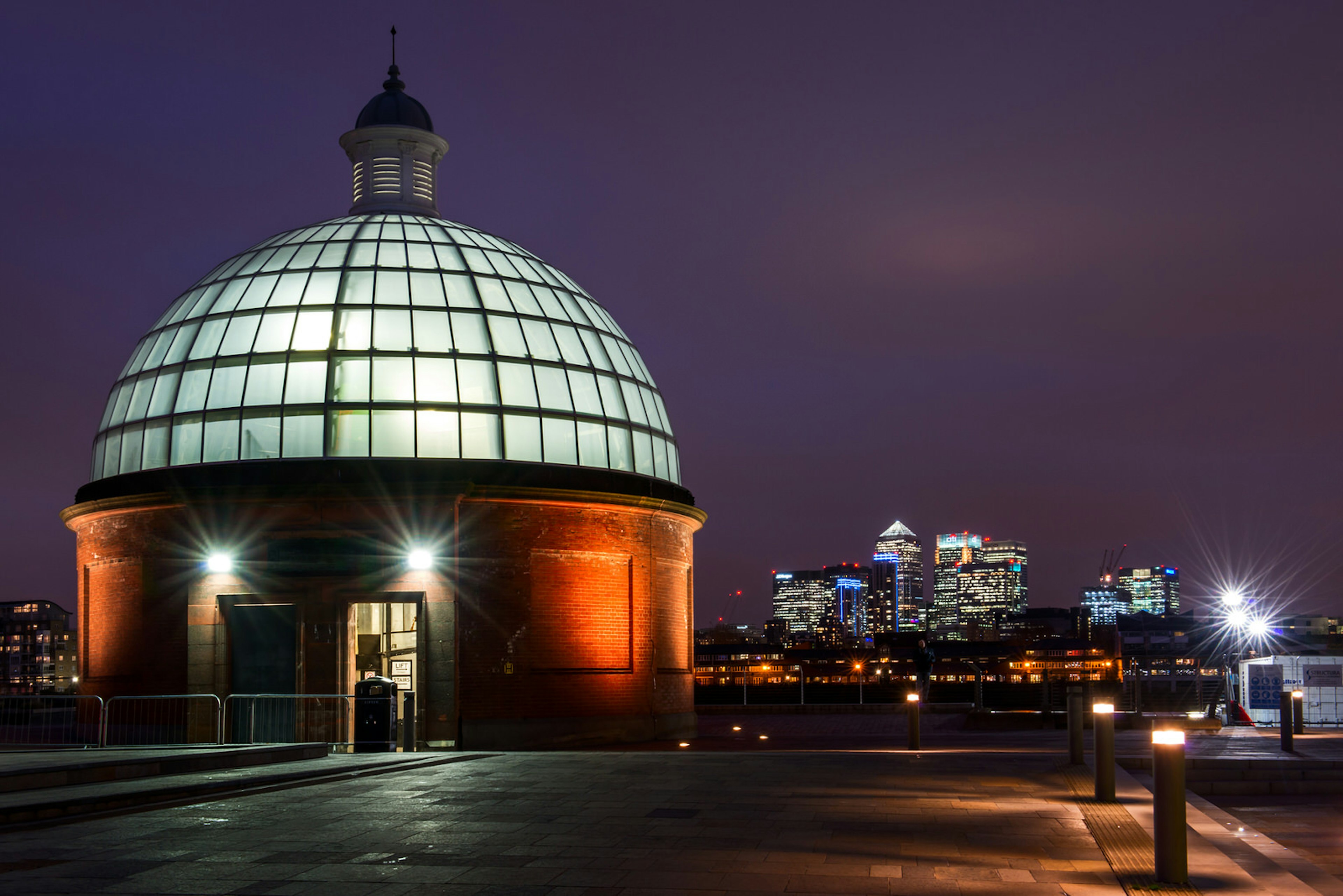 The entrance to the Greenwich Foot Tunnel, with Docklands in the distance © Rainprel / Shutterstock