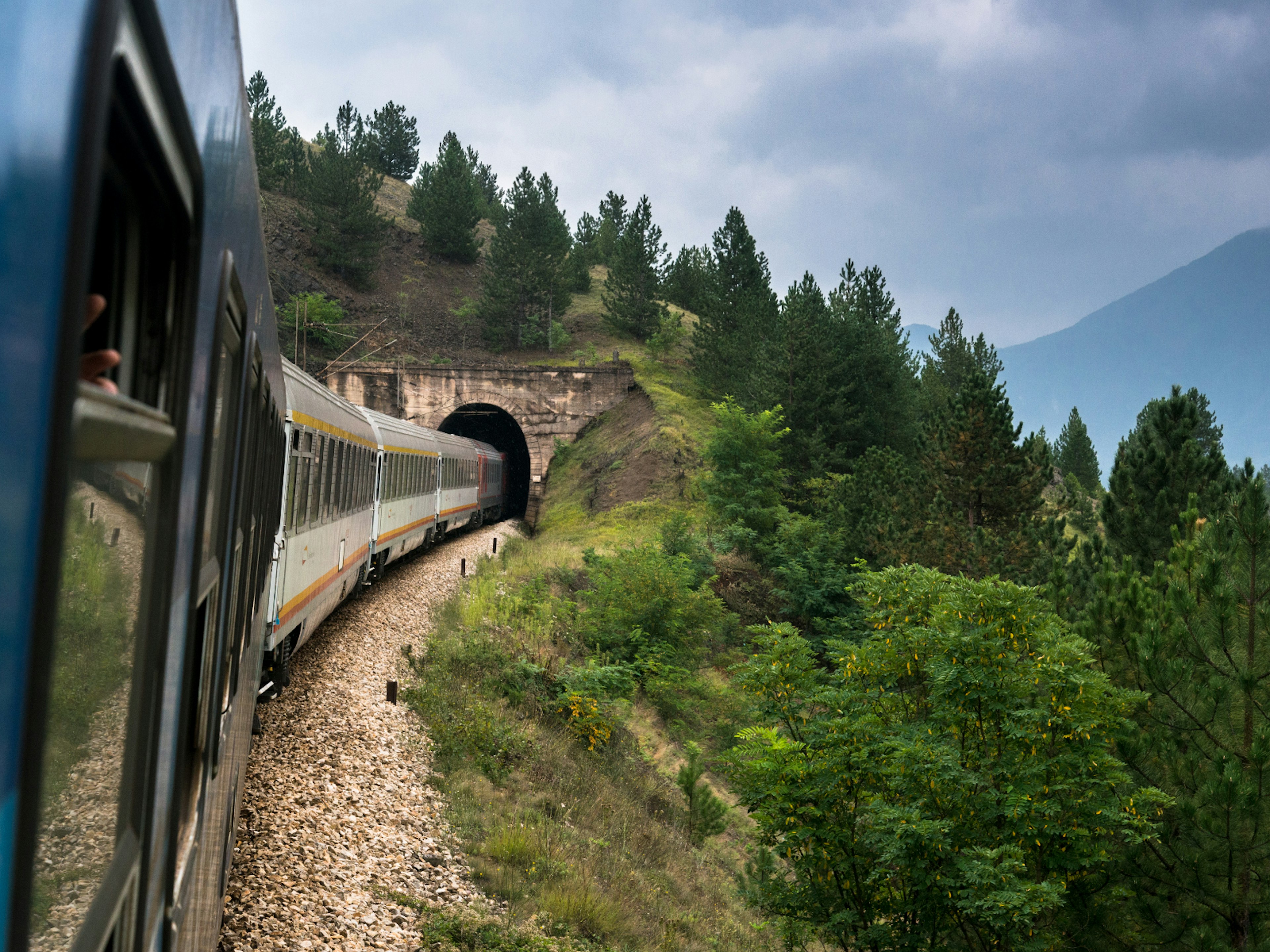 Belgrade-Bar train entering one of the numerous tunnels on the route