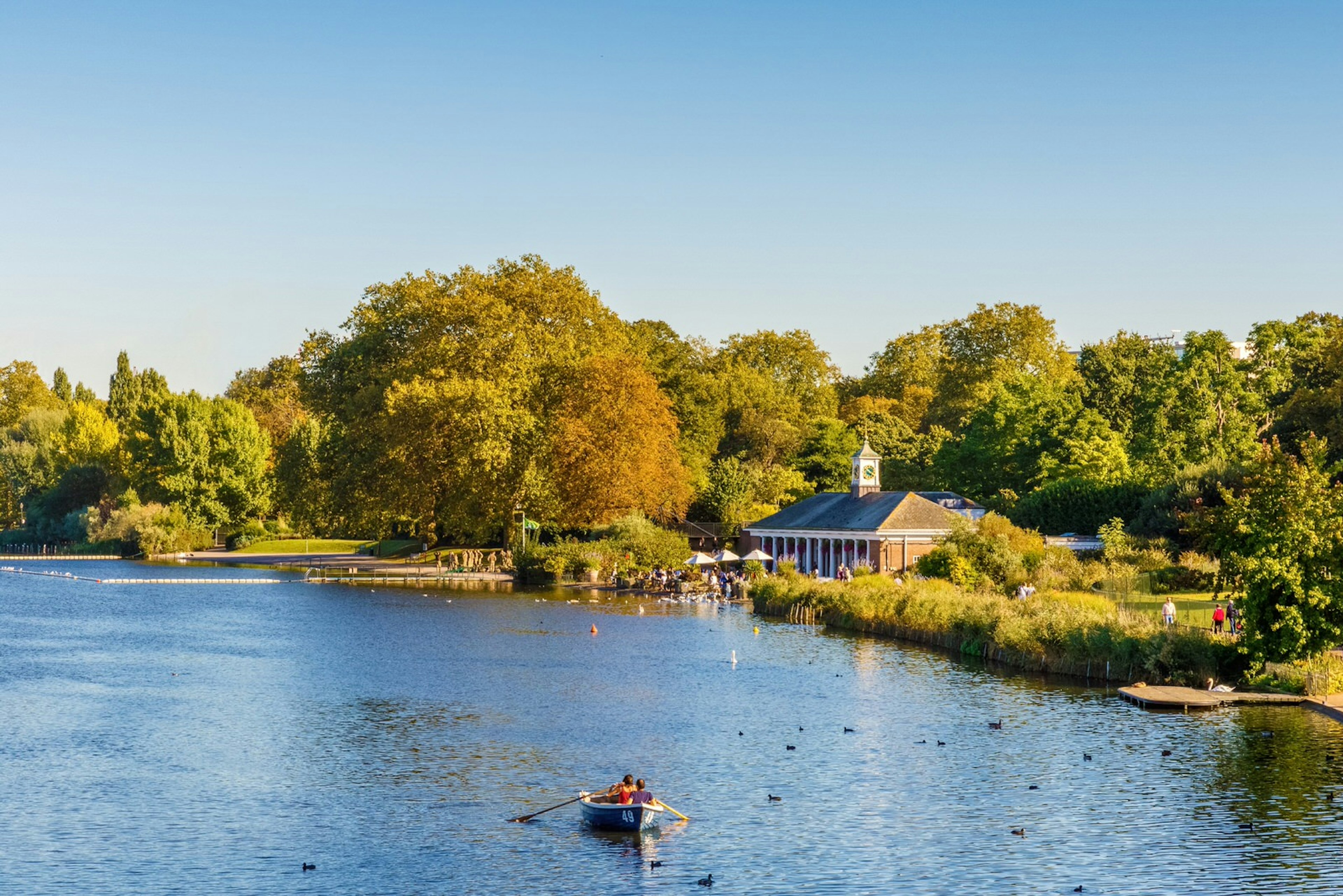 People rowing on the Serpentine lake in Hyde Park.