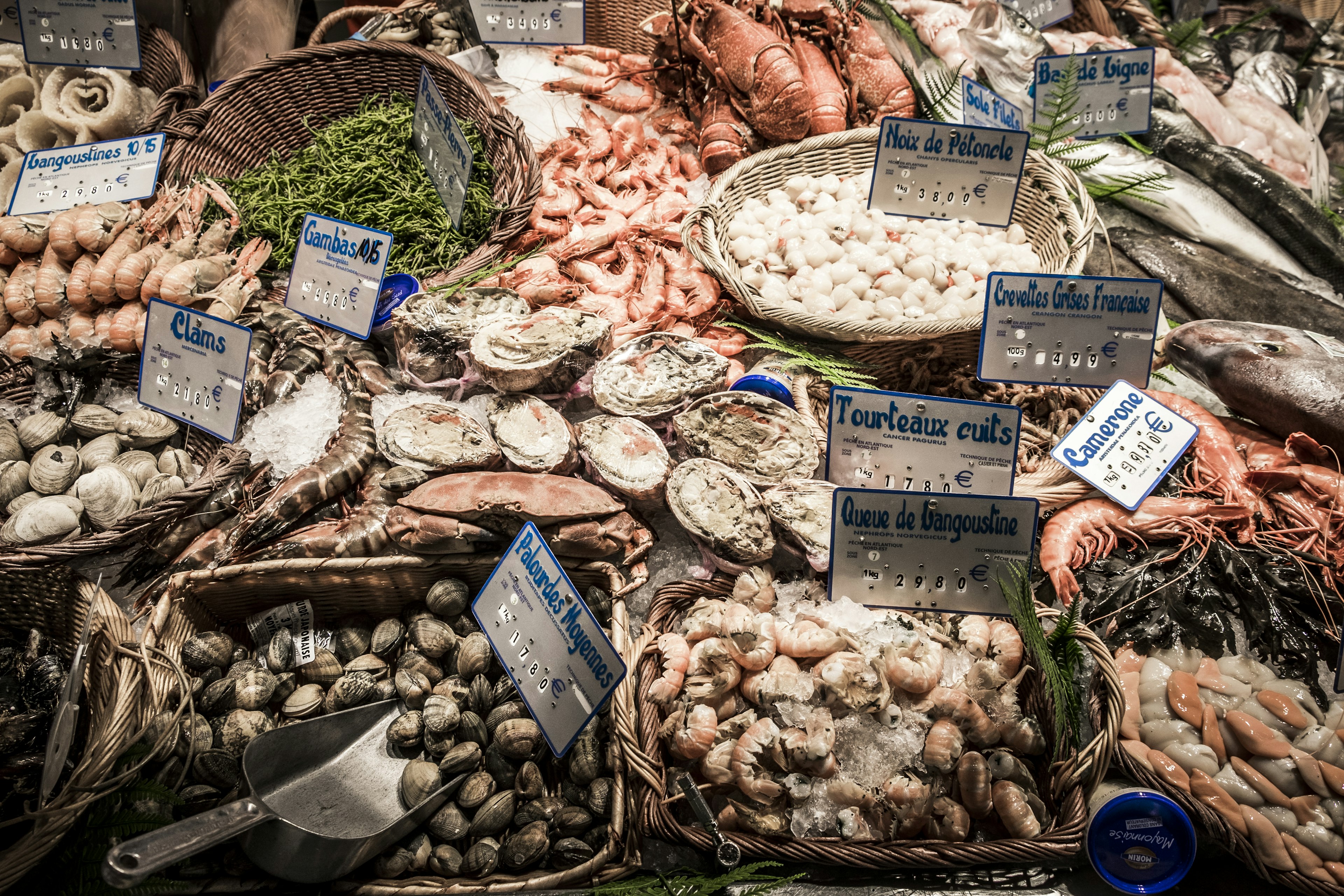 A profusion of shellfish and seafood on sale at the Marché Victor Hugo in Toulouse, France