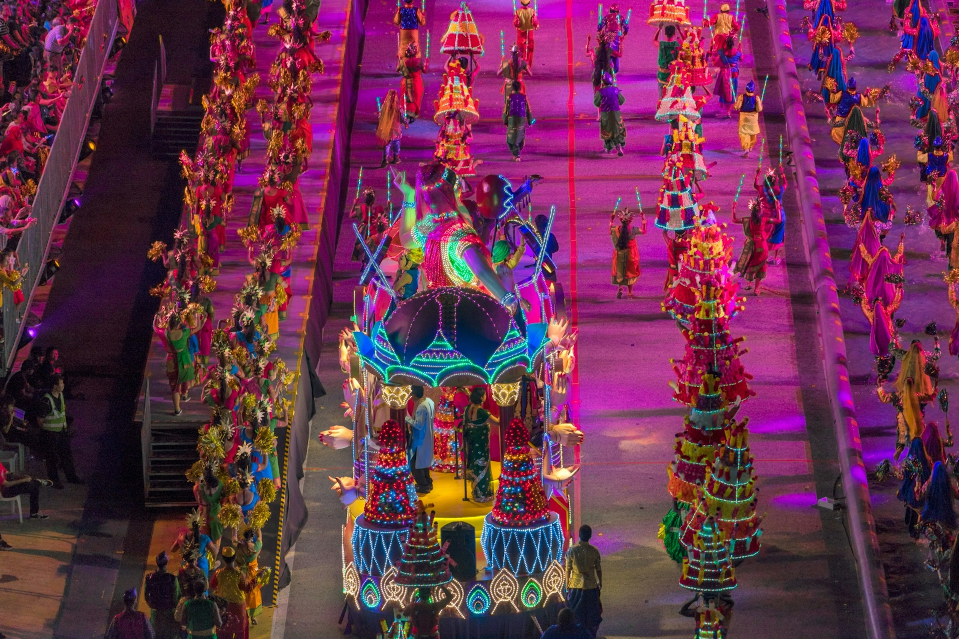 An large float covered in bright lights makes its way down the Chingay parade path.