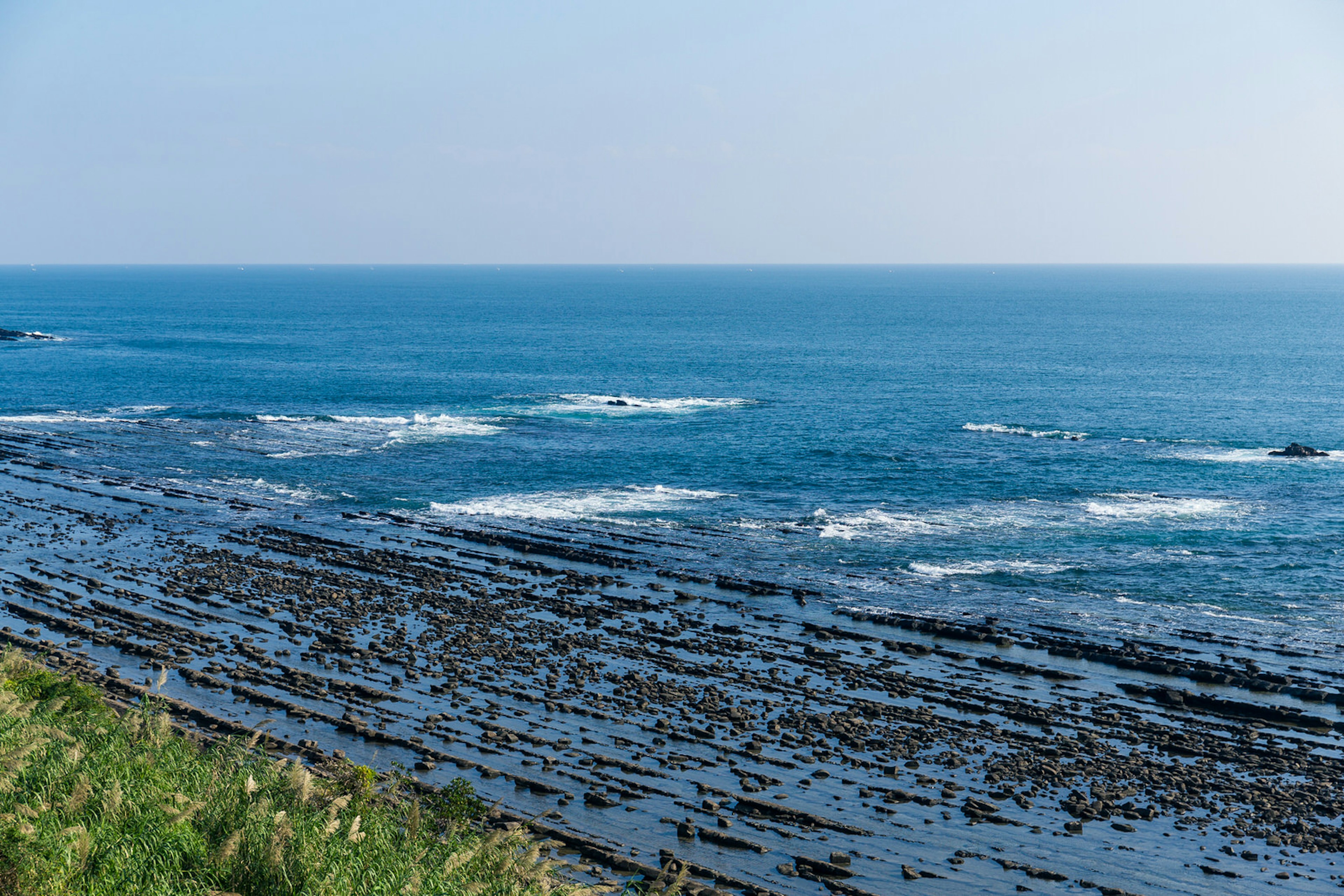 Lesser-known surfing spots – Aoshima's coast features rock formations called the Devil's Washboard.